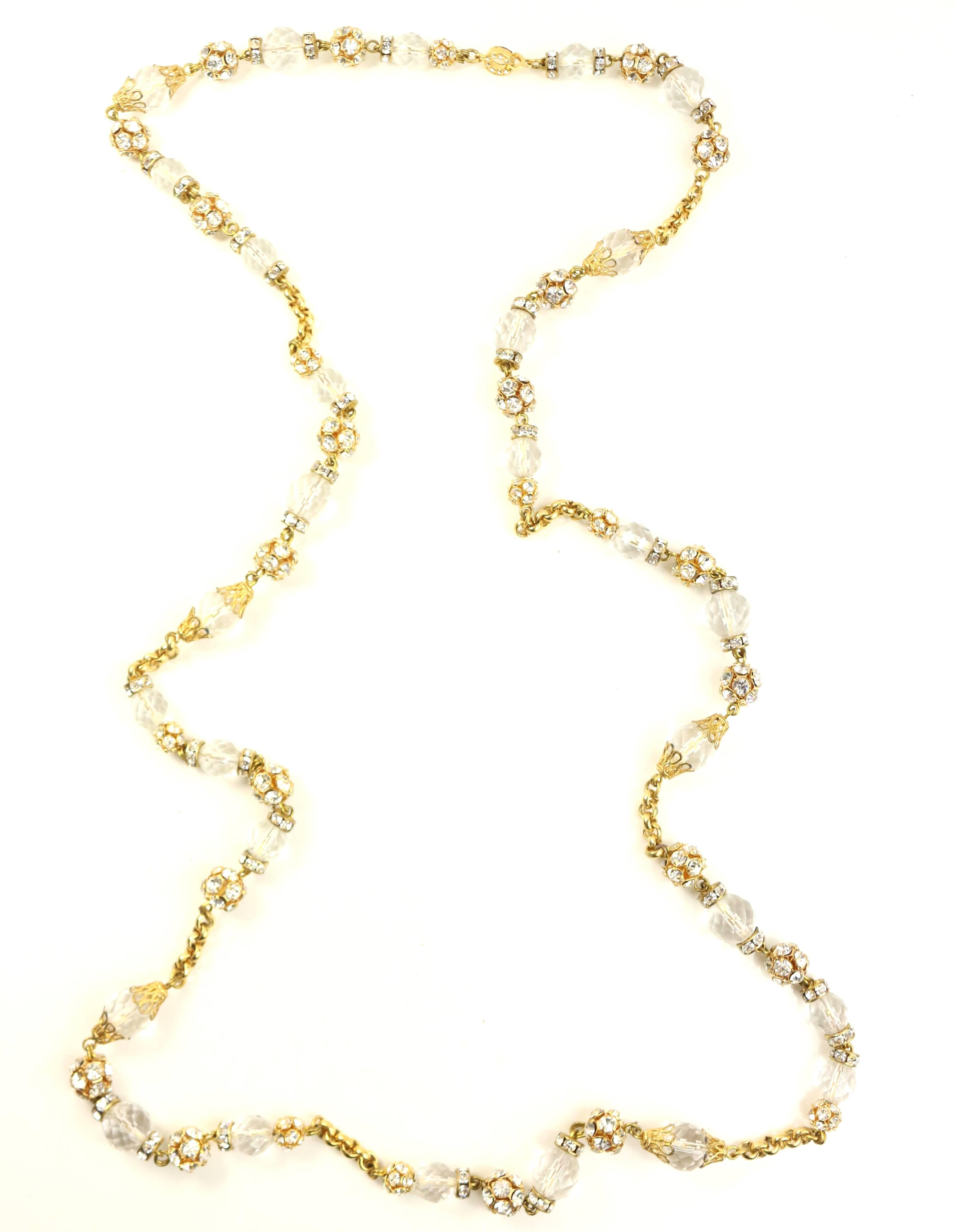 - Vintage 80s Escada gold toned metal with crystal rhinestones and glass chain necklace. 

- Gold toned with rhinestones "C" hook closure. 

- Length: 43 inches. 

- 50% glass, 50% metal. 

