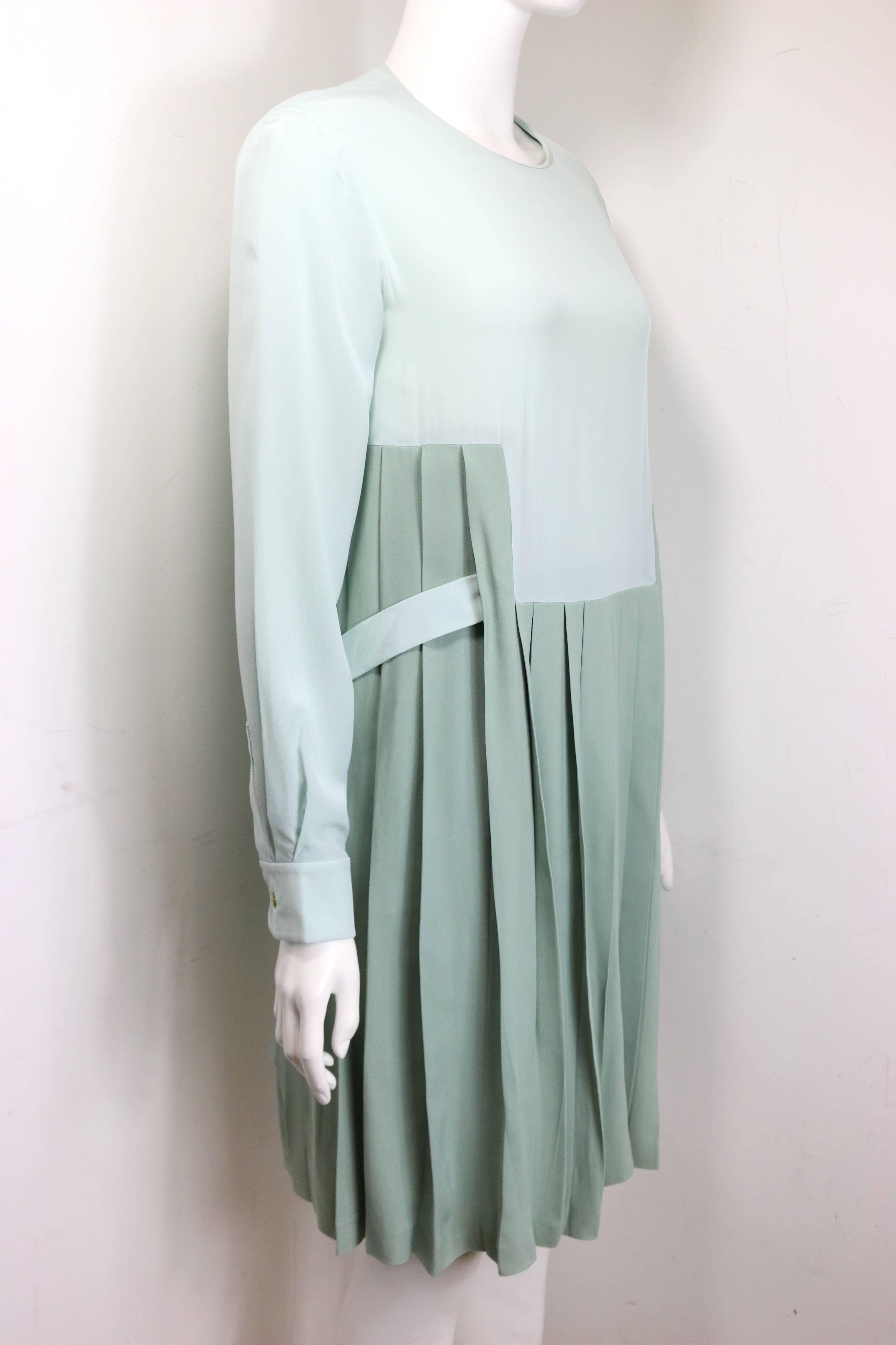 - Chloe green silk two-tone pleated long sleeves dress. Double layer with a white layer underneath. 

- There is a belt on the waist with button closure. 

- Back 