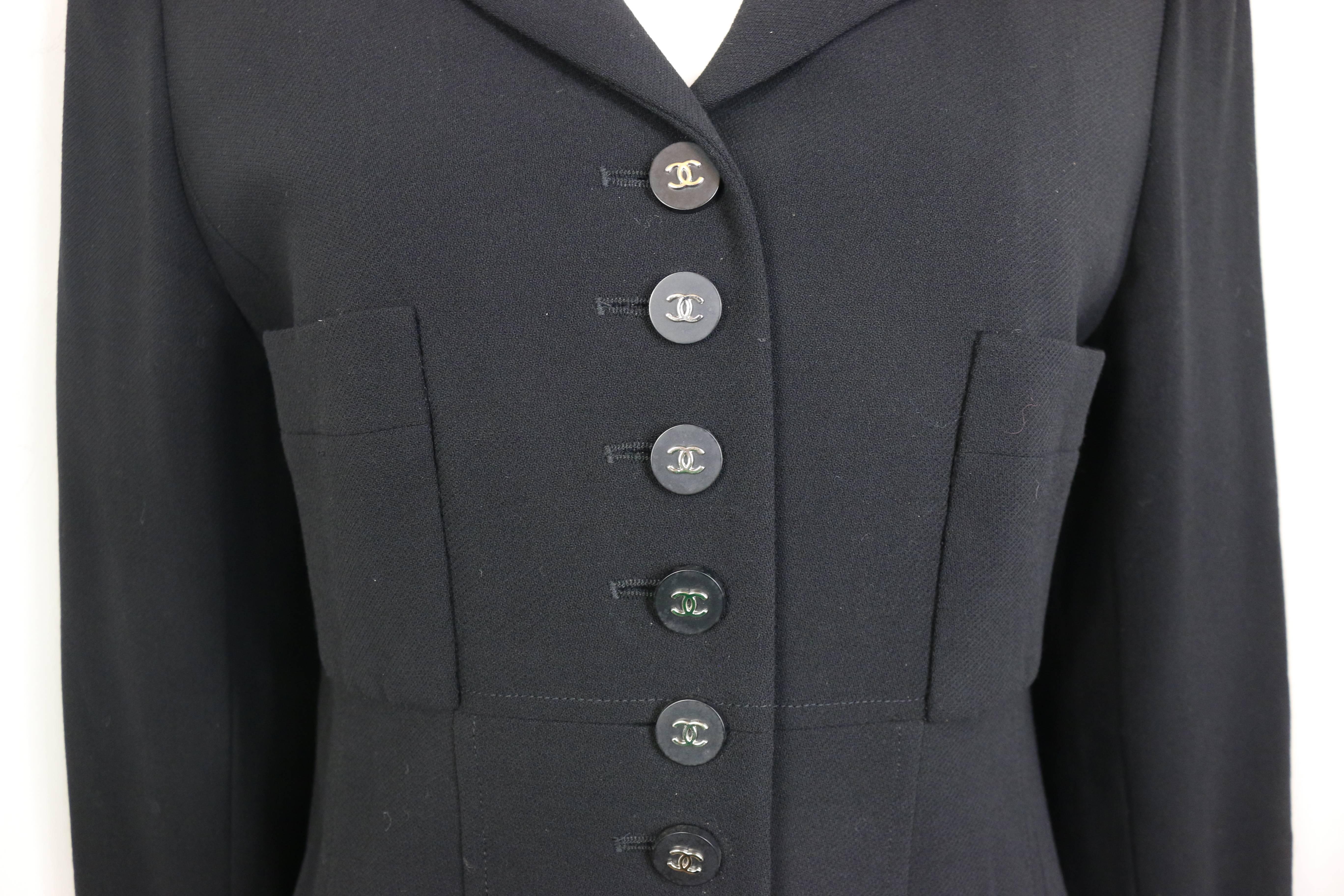 - Vintage Chanel classic black wool jacket from 1996 pre-collection. 

- Featuring silver 