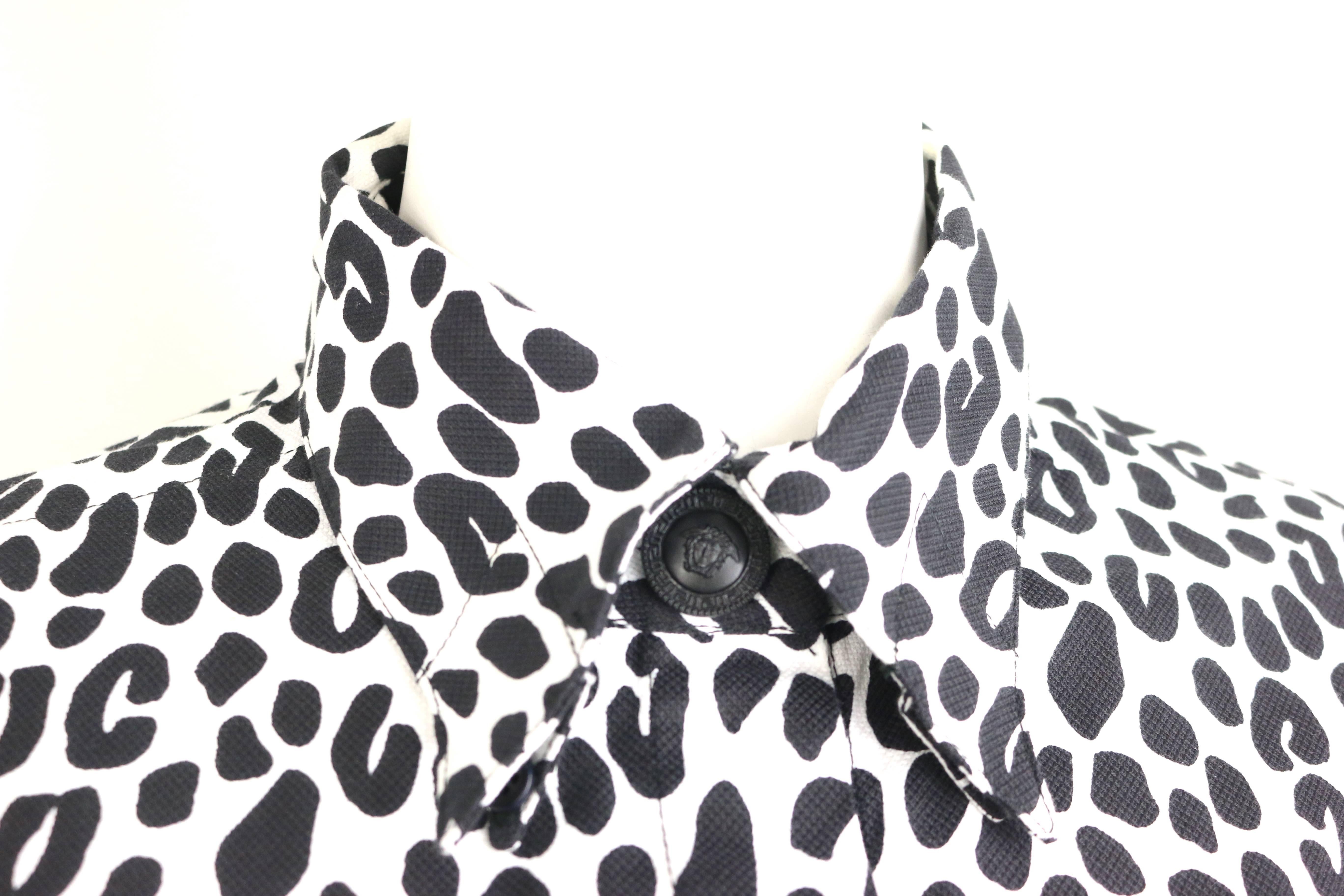 - Vintage 1996 Gianni Versace Couture white and black dalmatian print cotton shirt. Gianni Versace himself was born in the year of Dog. 

- Featuring pointy collar with black buttons closure. Black signature 