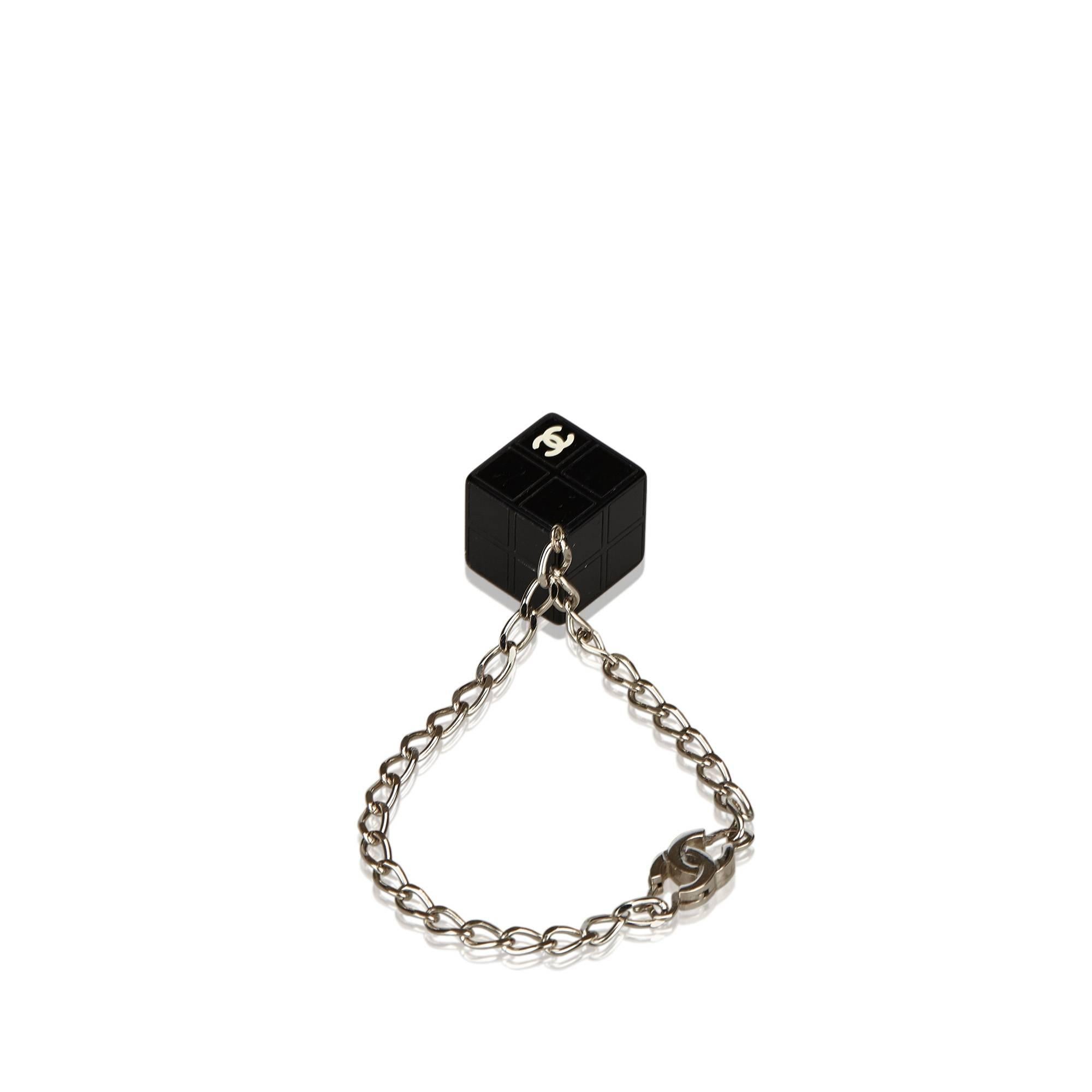 - This Chanel black bracelet features a resin cube pendant, silver-tone chain, and a hook closure.

- Size: 0.5cm x 19cm. 

- Serial no: 04S. 

- Color: Black x Silver. 

- Condition: We would rate it 6.5 out of 10. Since this is a vintage item,