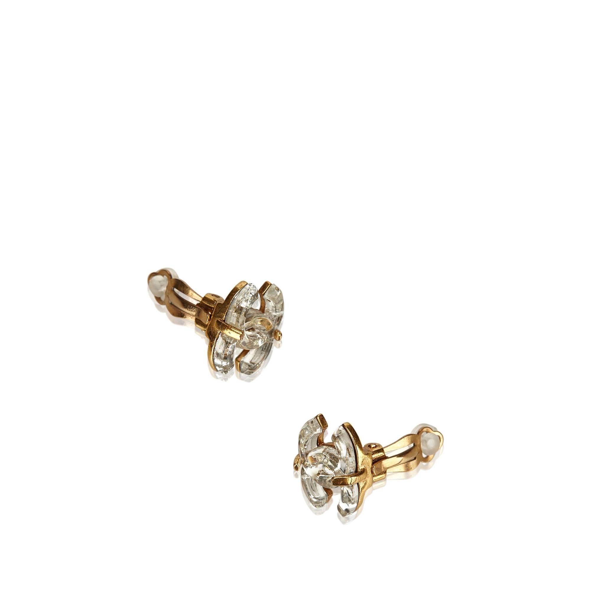 - Thes Chanel earrings feature a gold-toned metal hardware with silver 