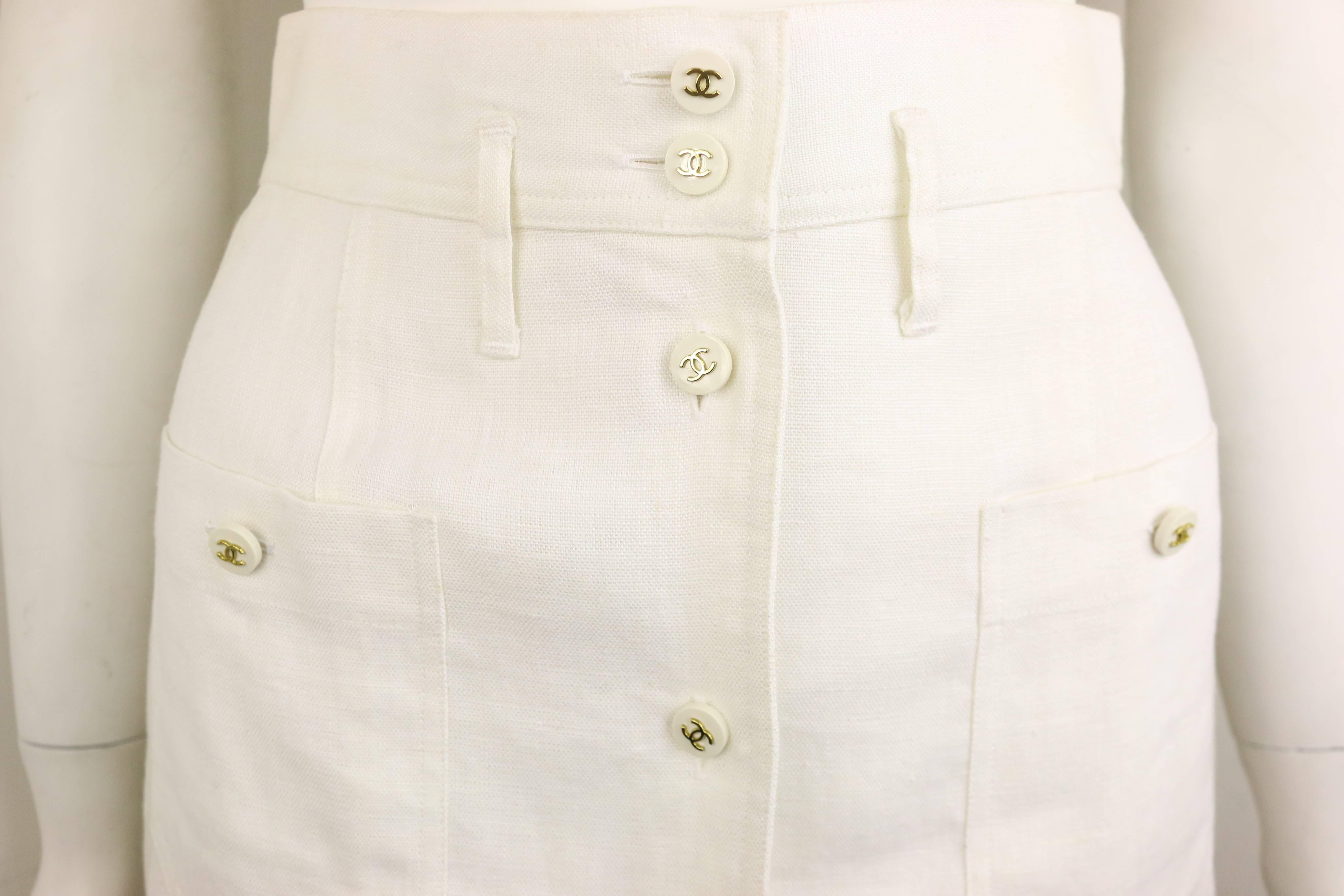 - Vintage 90s Chanel classic white linen skirt. 

- Featuring white gold-toned 