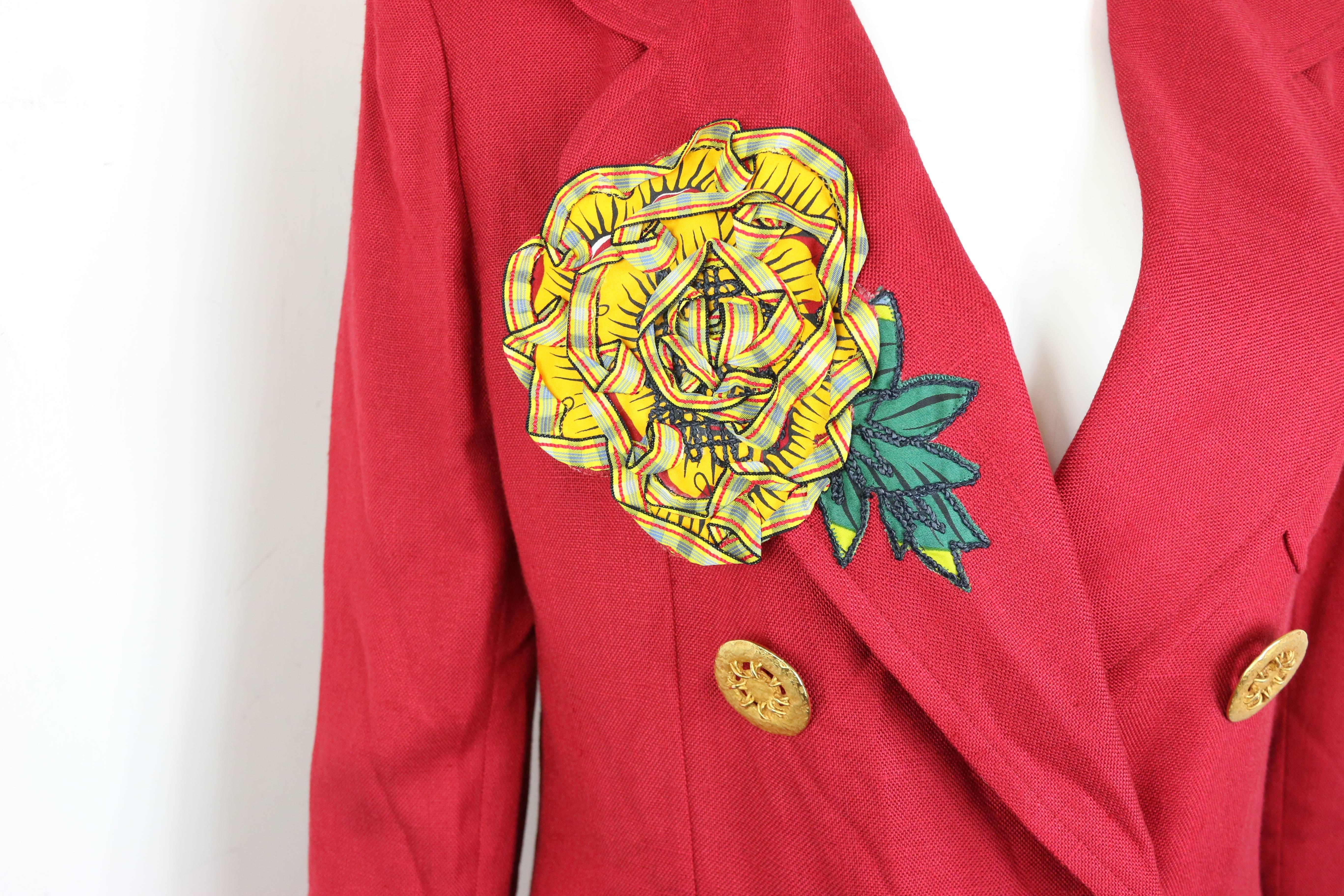 - Vintage 1994 spring Christian Lacroix red double-breasted blazer. It is a rare and collectible item. 

- Featuring a yellow ruffle sunflower on the right lapel and three at the back. 

- Gold-toned hardware buttons closure. 

- Two front open