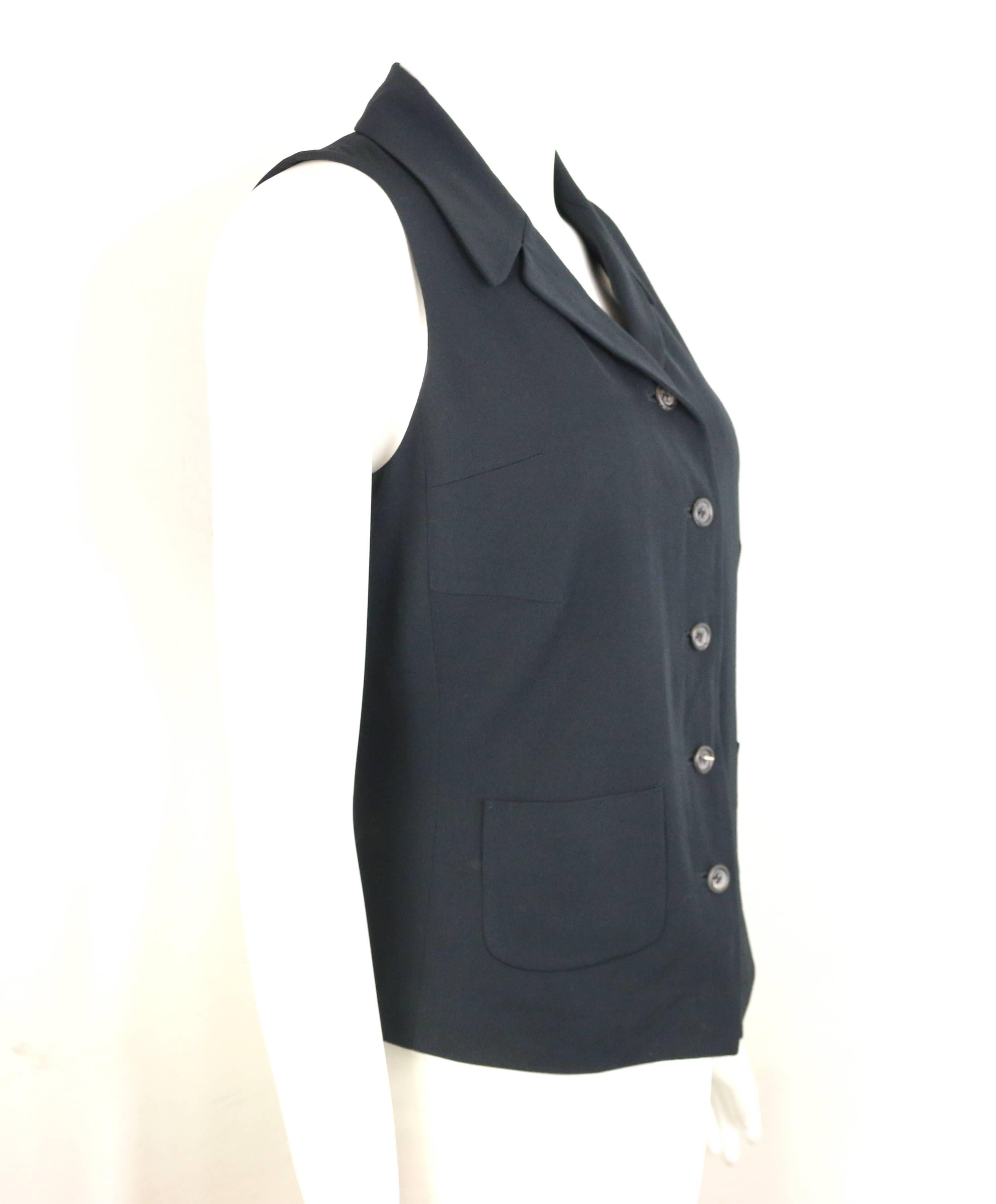 - Vintage 90s Jil Sander black viscose and wool vest. 

- Featuring a notch lapel, button closure, and two front open pockets. 

- Size 36. 

- 52% Viscose, 48% Wool. Lining: 100% Cuppo. 
