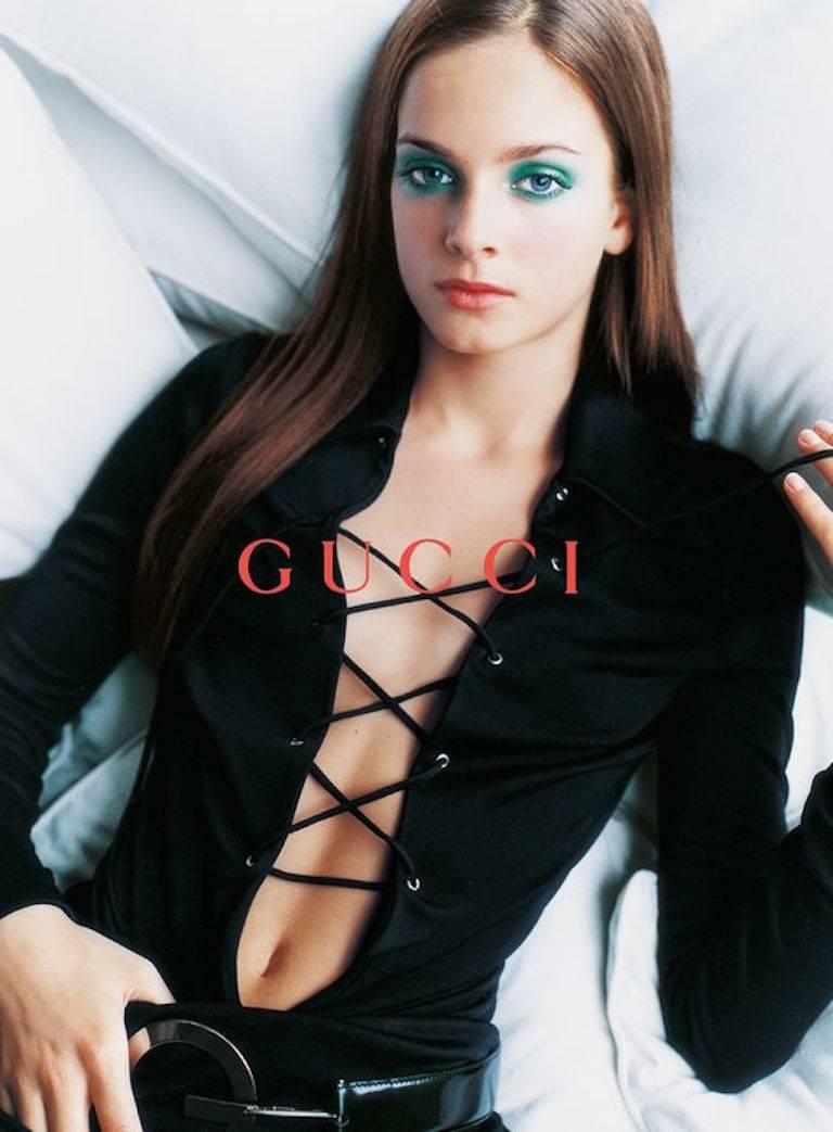 - Vintage 1996 Spring/Summer Tom Ford for Gucci black jersey tunic dress. This dress had been shown in the ad campaign.  Tom Ford is a genius for making women sexy! 

- Featuring a pointy collar with deep V- neck with strap tieing across the