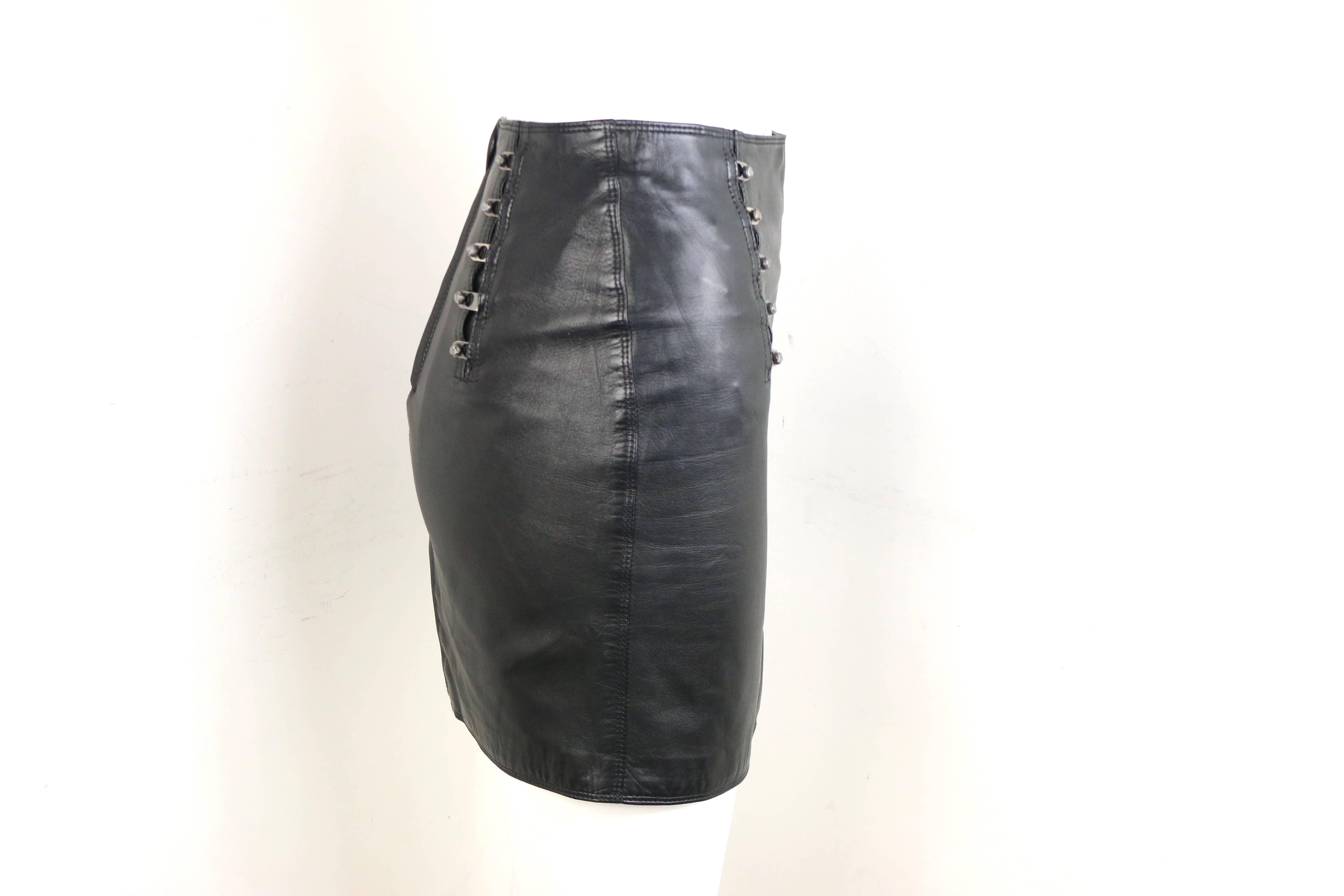 - Vintage 90s Gianni Versace black lambskin leather pencil skirt. 

- Featuring silver-toned 
