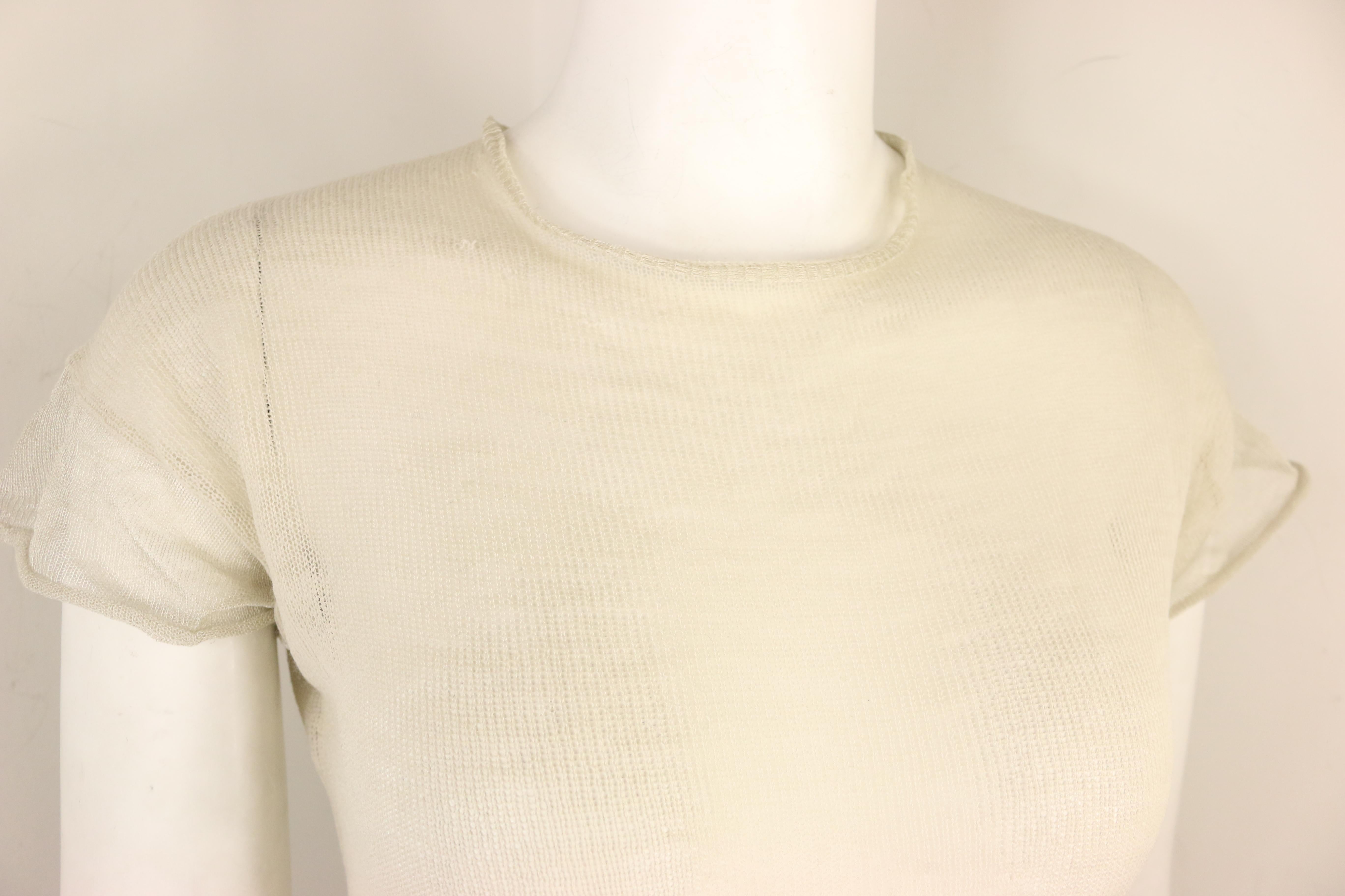 - Vintage 90s Jil Sander wool and silk ivory knitted short sleeves top. This is a fine wool knitted transparent top for summer. This item really shows the minimal effortless signature design and style of Jil Sander! Also, you can pair it with jeans.