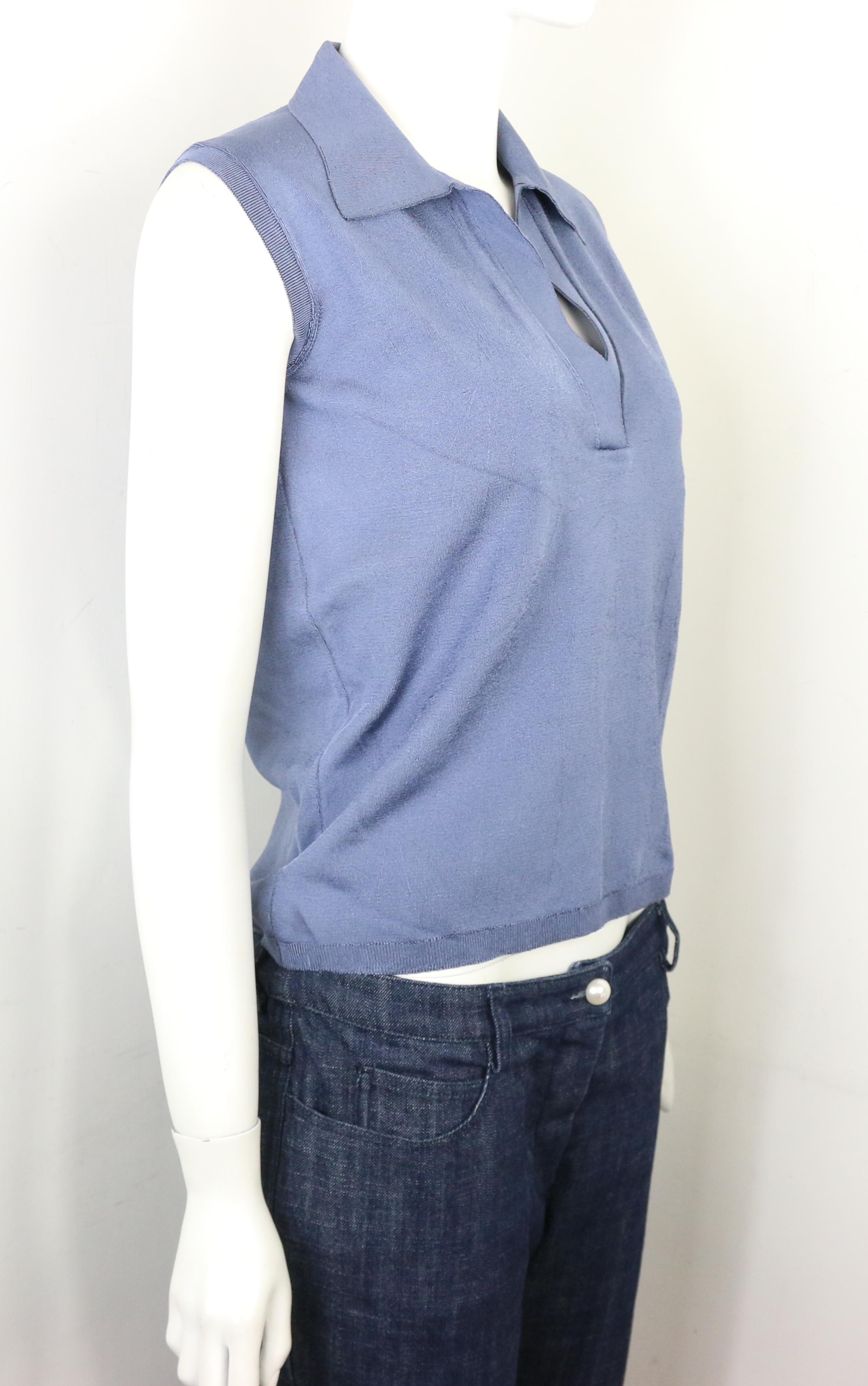 - Vintage 90s blue silk knitted sleeveless opening collar top. 

- Featuring ribbed sleeves, hem, and the front opening. 

- Size 42. 

- 100% Silk. 
