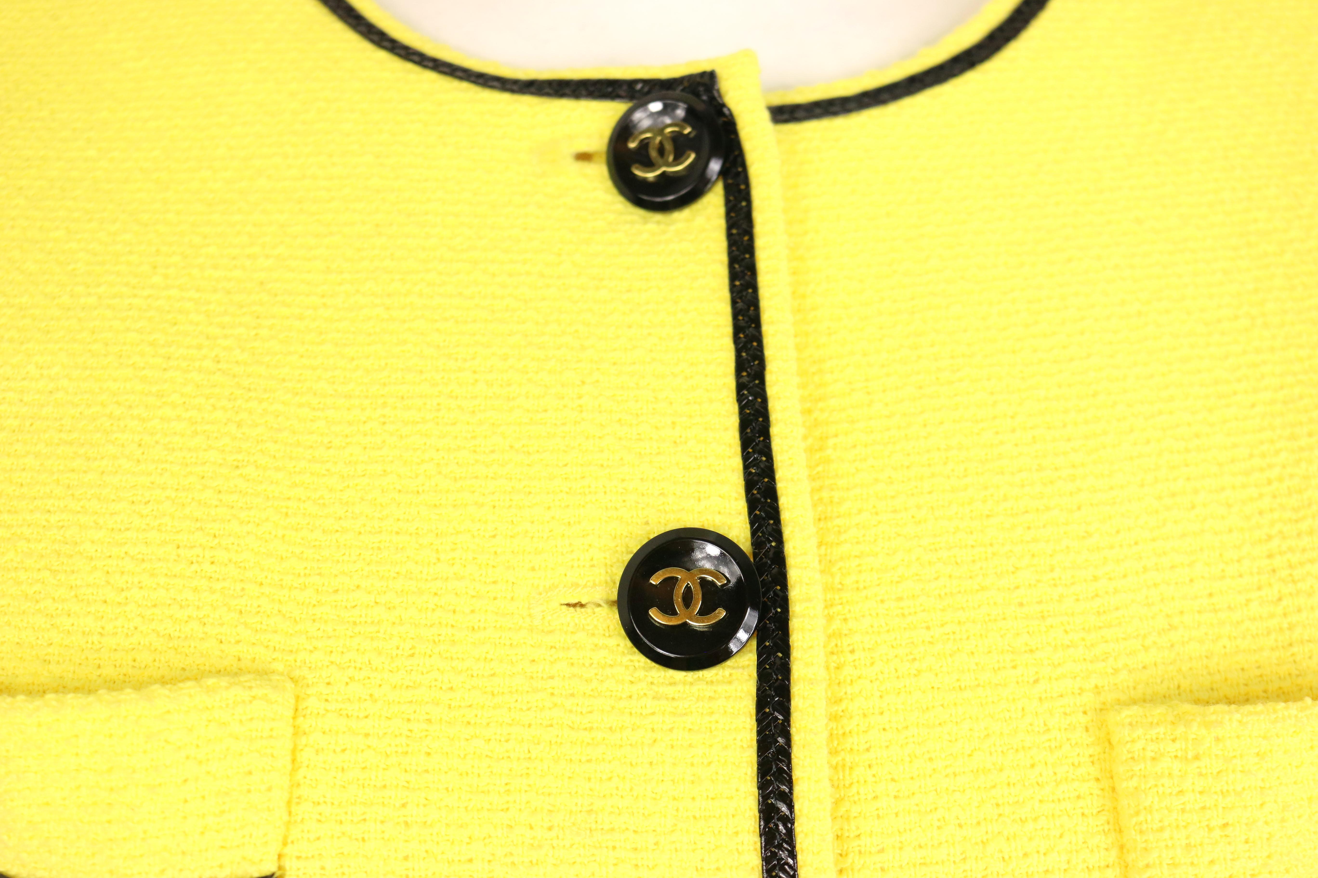 - Vintage Chanel yellow cotton short sleeves cropped jacket from spring 1995 collection. This is a signature item in the spring 1995 collection.  It is really rare and in excellent condition!

- Featuring black vinyl piping trim.  Black gold-toned