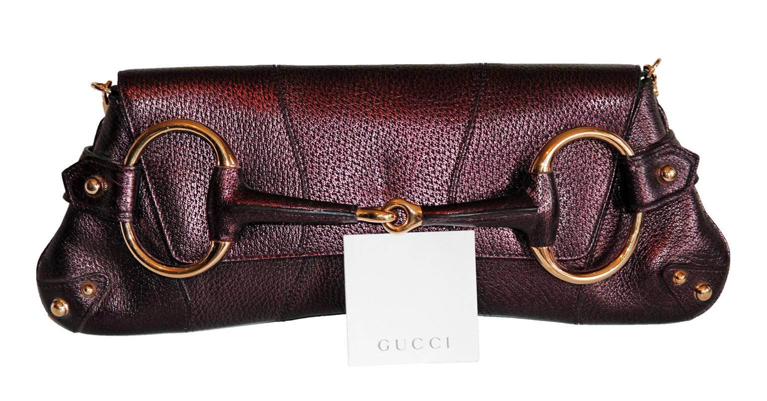 Uber-Rare Tom Ford Gucci Fall Winter 2004  Metallic Aubergine Leather Horsebit Bag!

So many of Tom Ford's incredible runway collections for Gucci & YSL will forever hold a place in fashion history, as well as in people's hearts, for the
