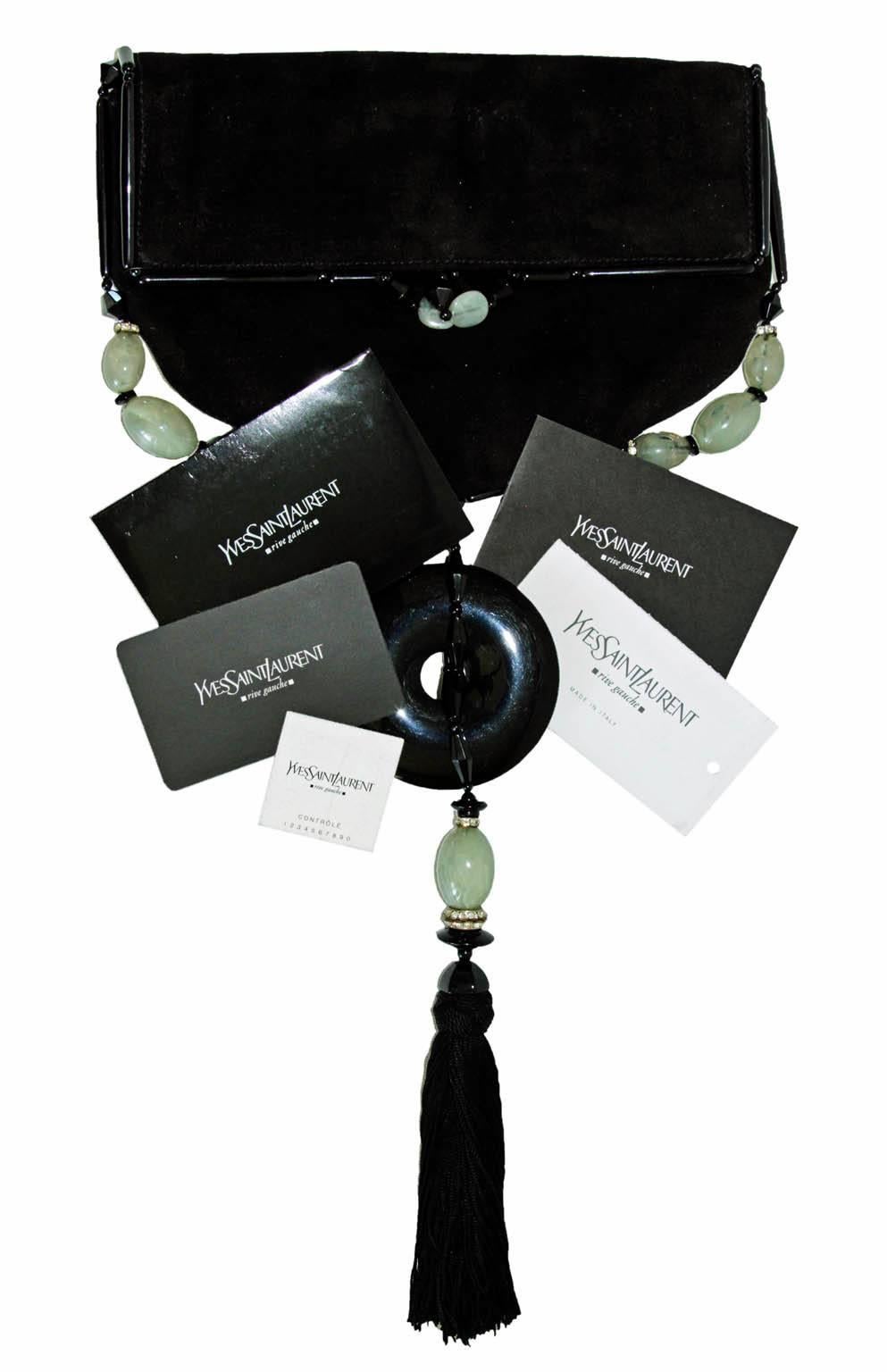 Who could ever forget that Incredible black suede leather runway bag with the tassel work and swarovski crystal detailing from Tom Ford's dreamy fall/winter 2004 collection for Yves Saint Laurent Rive Gauche? This small clutch sized bag is  an