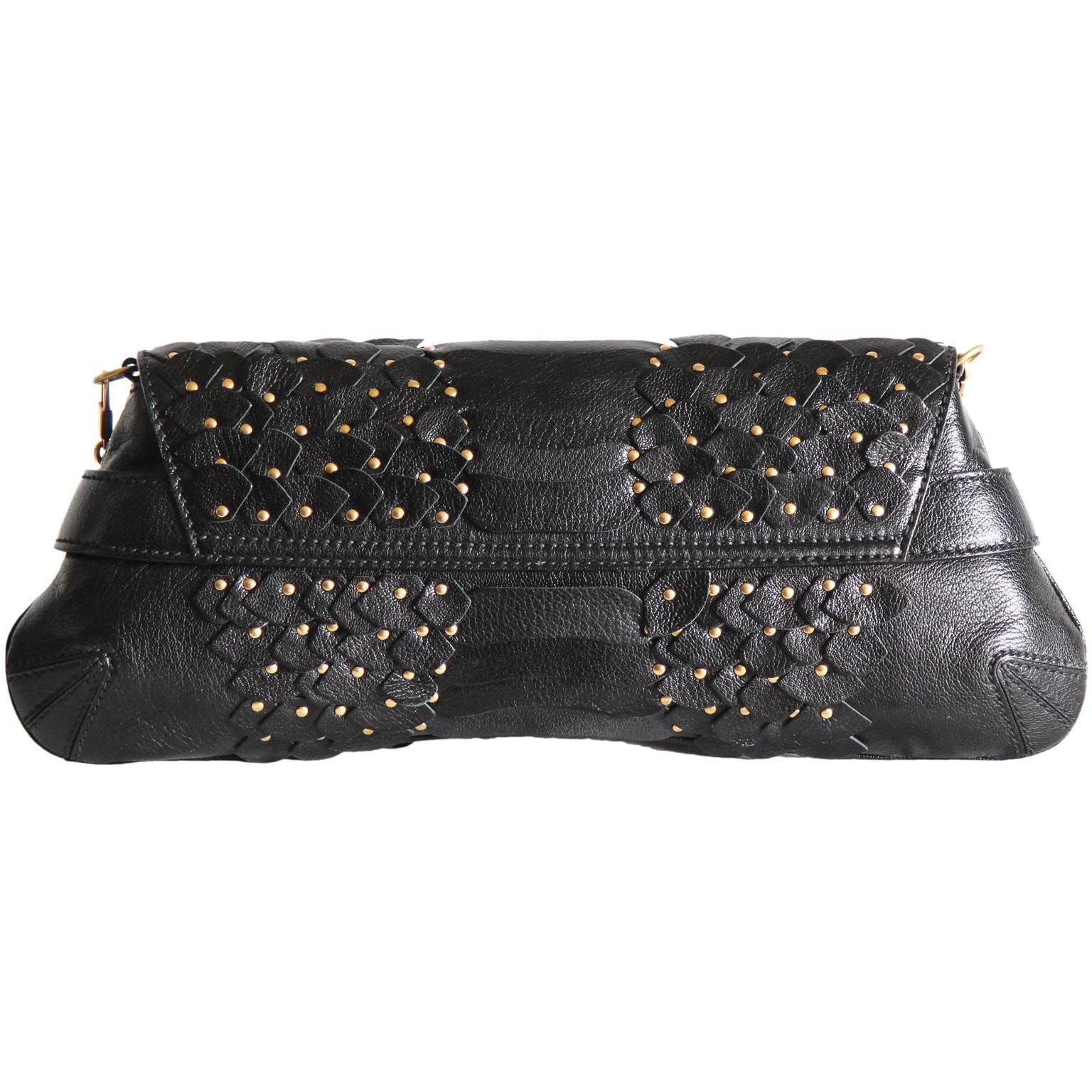 One of the most memorable Tom Ford for Gucci pieces of all... that ridiculously chic and insanely structured Tom Ford for Gucci Fall Winter 2003 black pieced-together and studded leather 'scaled' horsebit bag!

The Iconic Collections has been one of