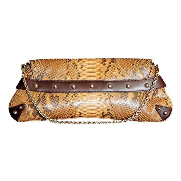 One of the most memorable Tom Ford for Gucci pieces of all... that ridiculously chic and insanely structured Tom Ford for Gucci Spring Summer 2004 brown studded python leather horsebit bag with the bamboo bit!

The Iconic Collections has been one of
