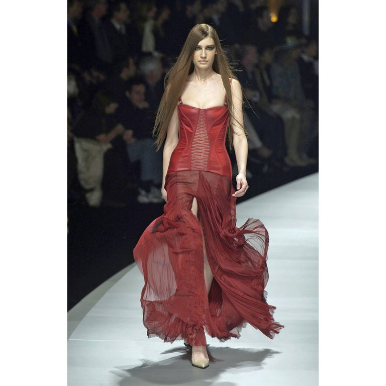 red corset versace dress See Anne Hathaway's Red Leather Versace Dress in Milan