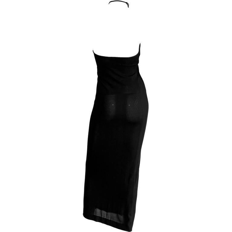 Utterly Rare & Iconic Tom Ford For Gucci Fall Winter 1997 Black Halter Asymmetrical Minimalist Maxi Dress!

Who could ever forget Tom Ford's fall winter 1997 collection for Gucci? Well this heavenly maxi dress, with its classic Ford detailing