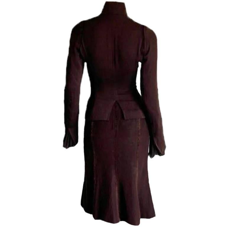 Among the most dreamy Tom Ford for YSL sets of all... that absolutely scrumptious and ridiculously rare Tom Ford for YSL Yves Saint Laurent Rive Gauche Fall Winter 2002 plum silk fitted Victorianesque jacket and skirt!

The Iconic Collections has