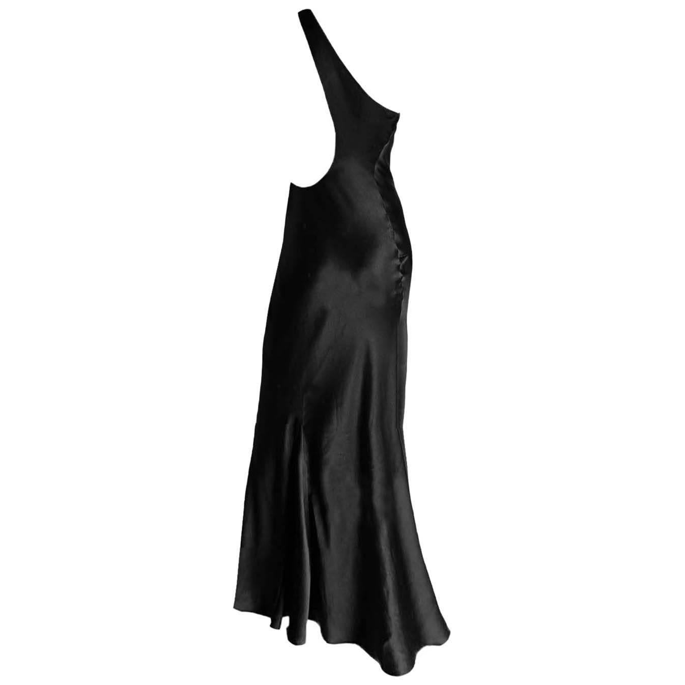 Uber Rare & Incredibly Chic Tom Ford For Gucci Spring Summer 2000 Black Silk Minimalist Backless Runway Gown!

Who could ever forget Tom Ford's spring summer 2000 collection for Gucci? This extraordinary gown, surely one of the most memorable