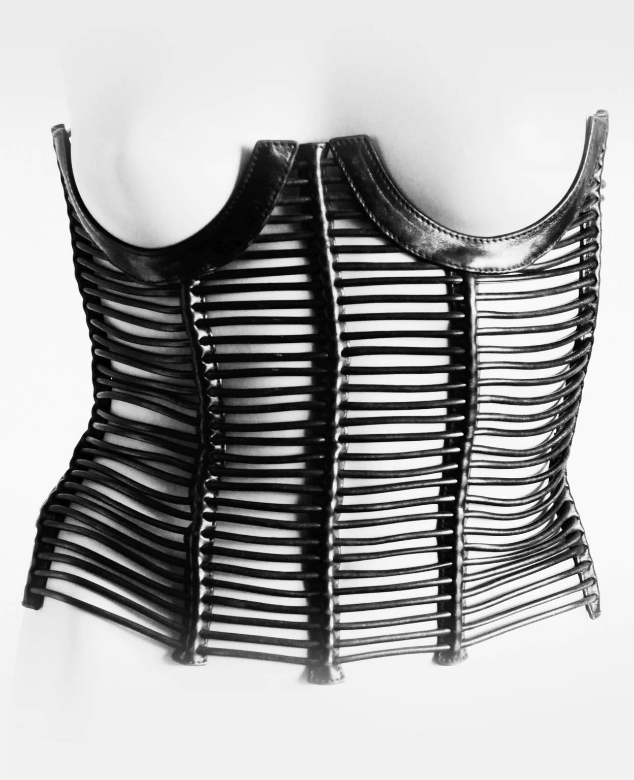 Who could ever forget those amazing leather corsets from Tom Ford's incredible spring/summer 2001 collection for Gucci, & this black rolled leather cage corset was without a doubt the most extraordinary of all! Famously worn by Kate Moss in the ad