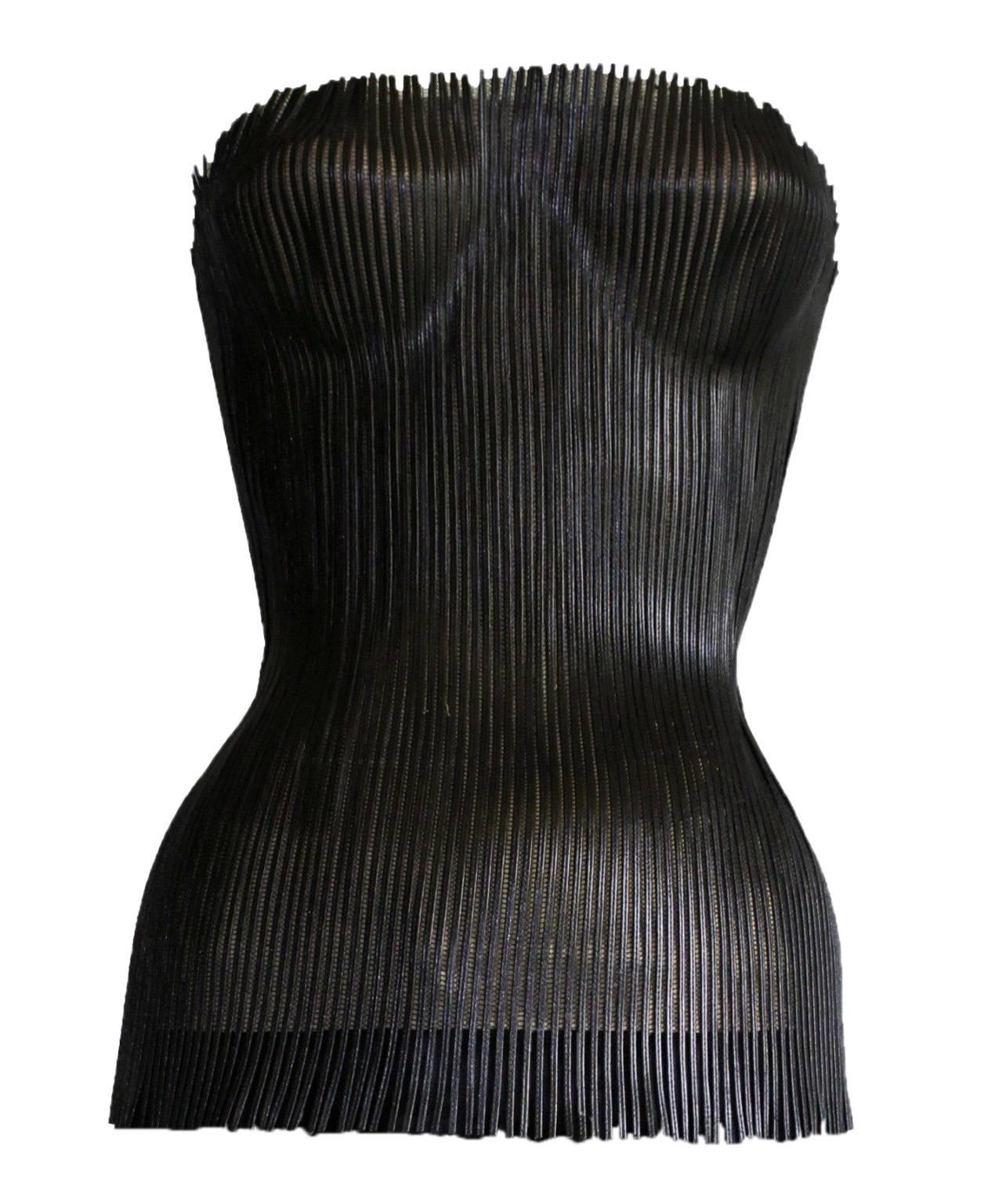 That Iconic & Amazing Tom Ford Gucci SS 2001 Black Leather Nude Corset Runway Top!

Who could ever forget that incredible nude corset top with the tulle overlay covered with black leather strips from Tom Ford's incredible spring/summer 2001