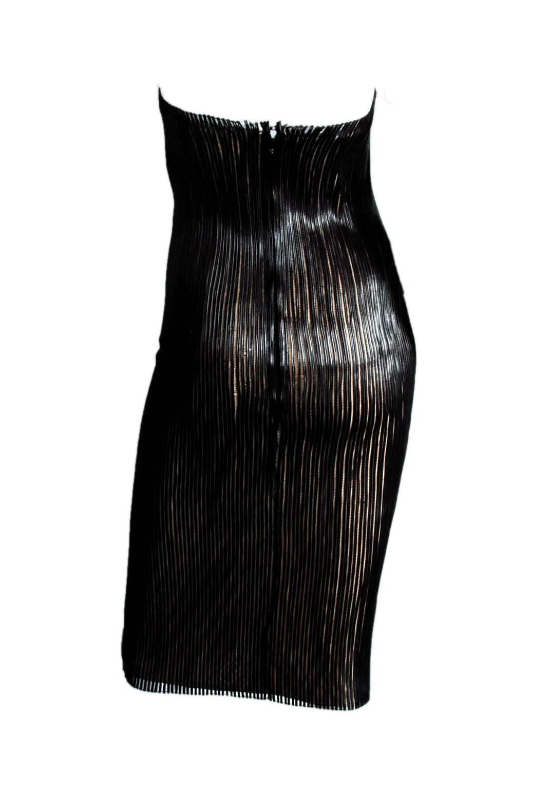 The Iconic Tom Ford Gucci SS 2001 Black Leather Nude Corset Runway Dress Kate Wore!

Who could ever forget that incredible nude corset dress with the tulle overlay covered with black leather strips from Tom Ford's incredible spring/summer 2001