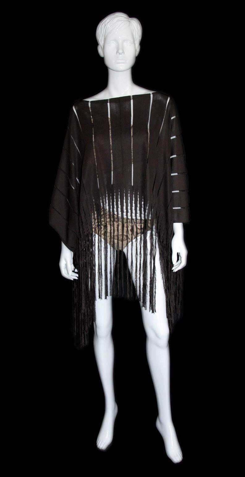 Rare & Iconic Tom Ford for YSL Rive Gauche SS 2002 Safari Collection Chocolate Brown Silk Poncho!

The quintessential piece from Tom Ford's acclaimed Spring/Summer 2002 Safari/Mombasa Collection for YSL Rive Gauche. This extremely rare & unique
