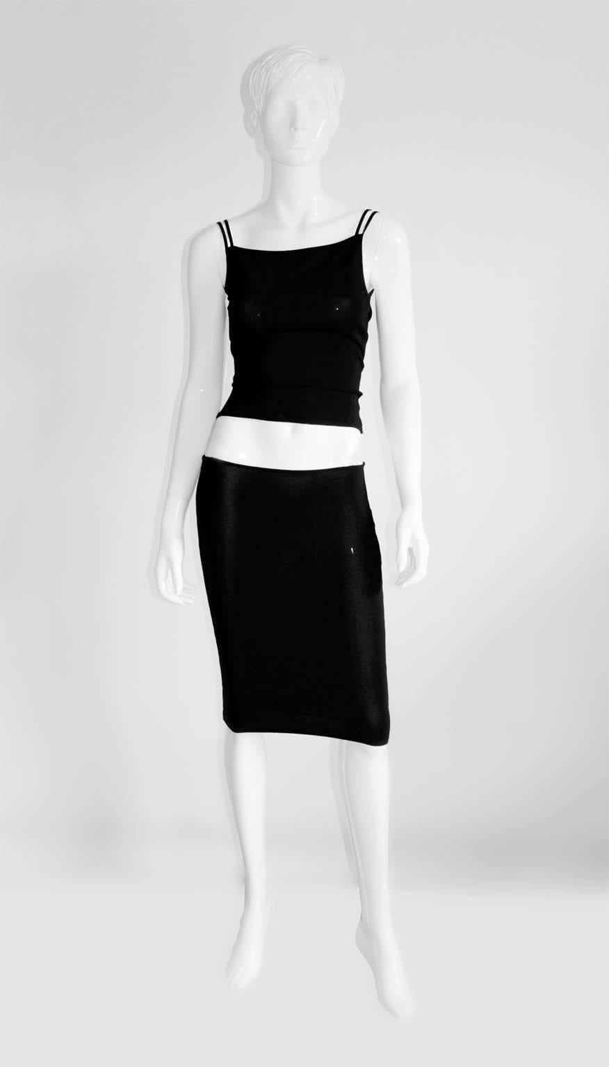 Two of the absolute stars of Tom Ford's Spring Summer 1998 runway collection for Gucci... that clingy knit skirt & matching top with the buckled leather shoulder straps!!!

The set is an italian size 42 & fits a US size 4-6 beautifully. Both