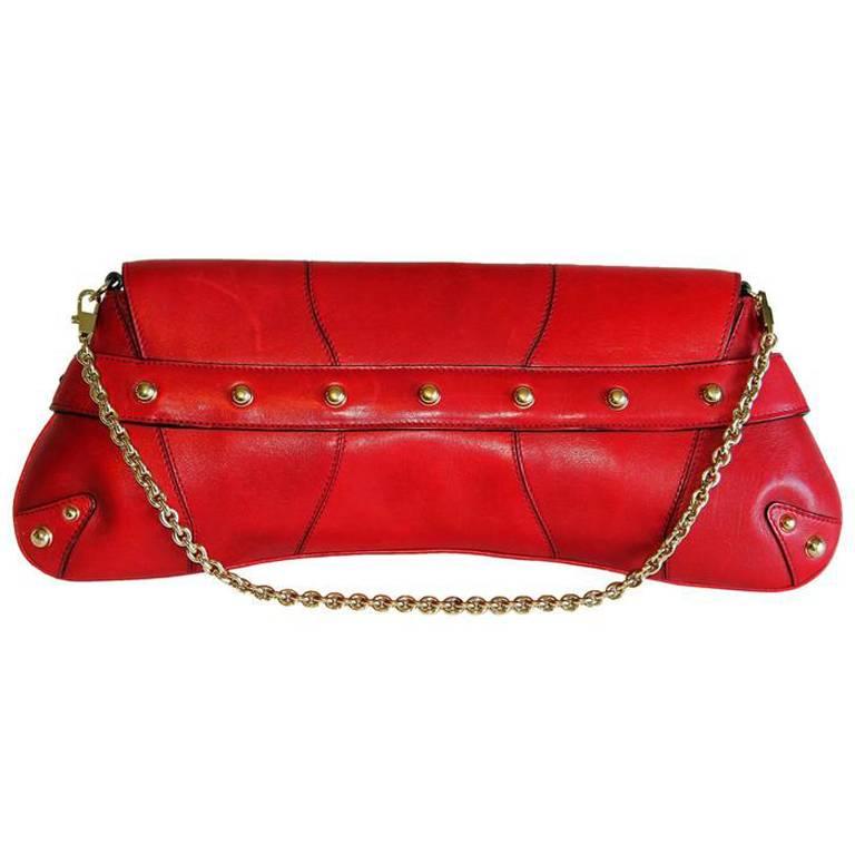 One of the most memorable Tom Ford for Gucci pieces of all... that ridiculously chic and incredibly rare Tom Ford for Gucci Spring Summer 2004 red studded leather horsebit bag!

Prior to the opening of our 1stdibs store in September of 2015, many of