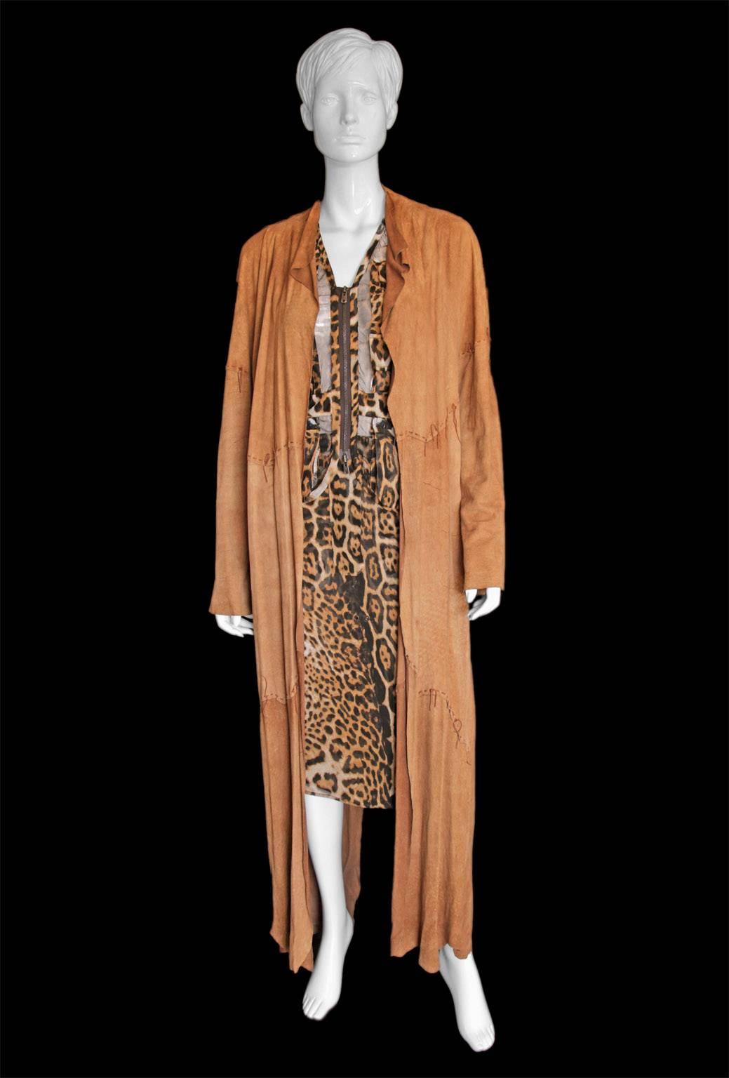 One of the most extraordinary pieces from Tom Ford's acclaimed Spring/Summer 2002 Safari/Mombasa Runway Collection for YSL Rive Gauche, this incredible full length suede leather coat is made from a number of entire hides, hand-stitched together