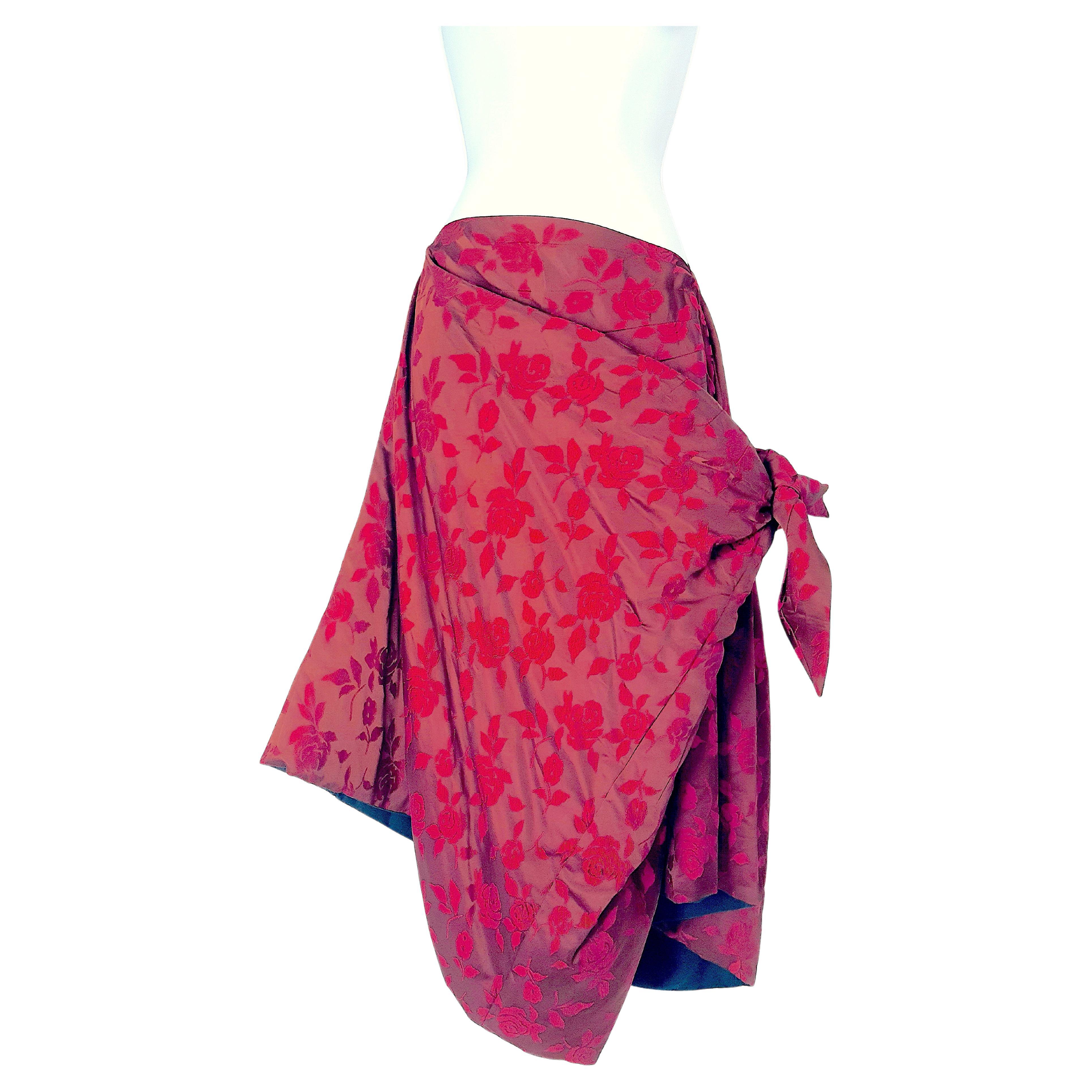 In 1996, Japanese Junya Wantanabe made this sculptural red whorled-rose jacquard padded evening coat/jacket cape to convert to an equally stunning asymmetrical A-line or symmetrical narrow skirt, while he was being groomed in the mid-1990s as a