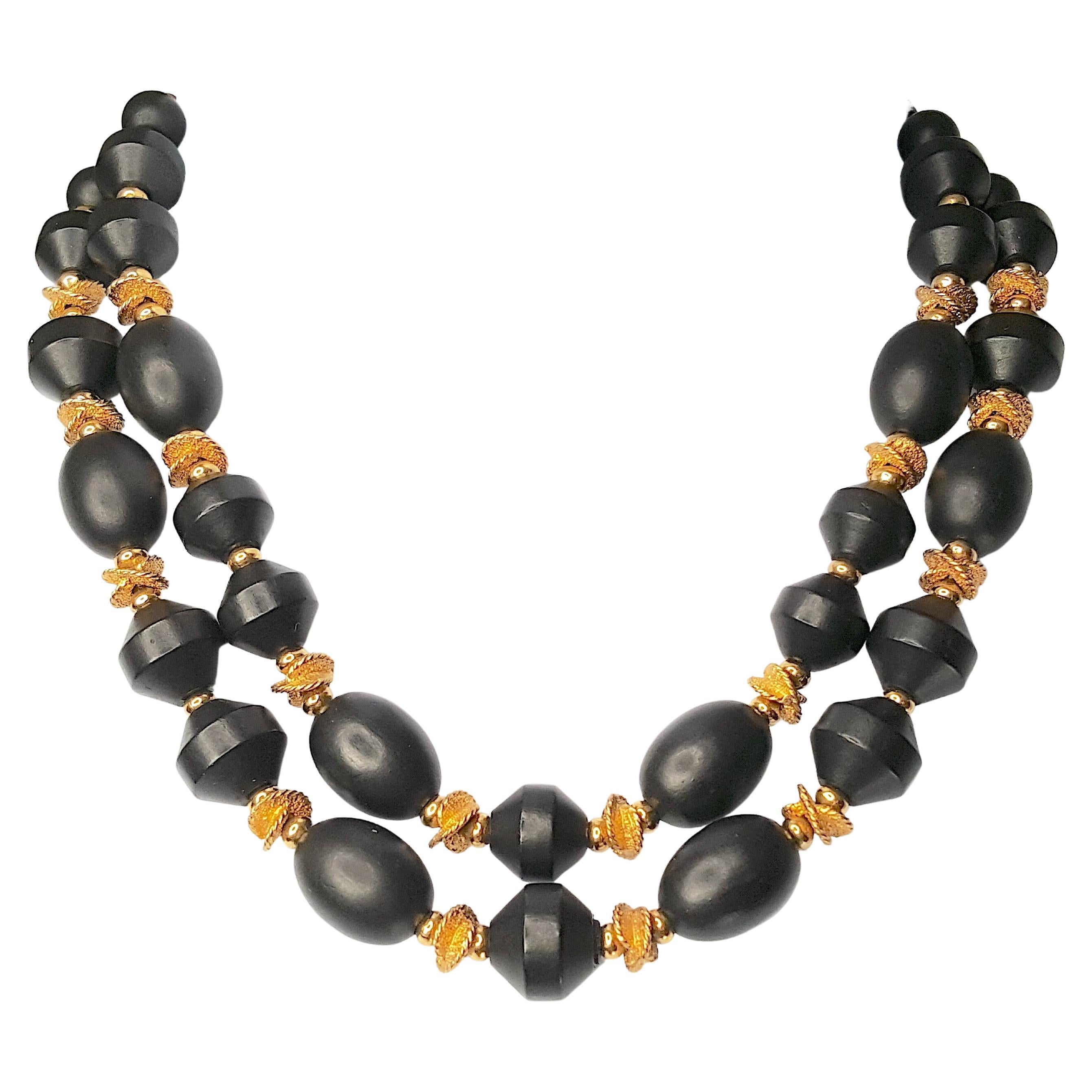 This Bakelite beaded double-strand black-and-gold necklace still sports the CoroCraft pegasus 1940s retail foil-tag. As an elegant take on 