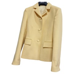 Blazer jacket from luxury brand GUCCI, in a sophisticated pale yellow hue