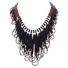 Art Deco cascading necklace of jet and crystal beads with a gold plating