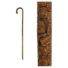 Japanese Meiji walking stick of carved bamboo featuring multiple faces, Meiji