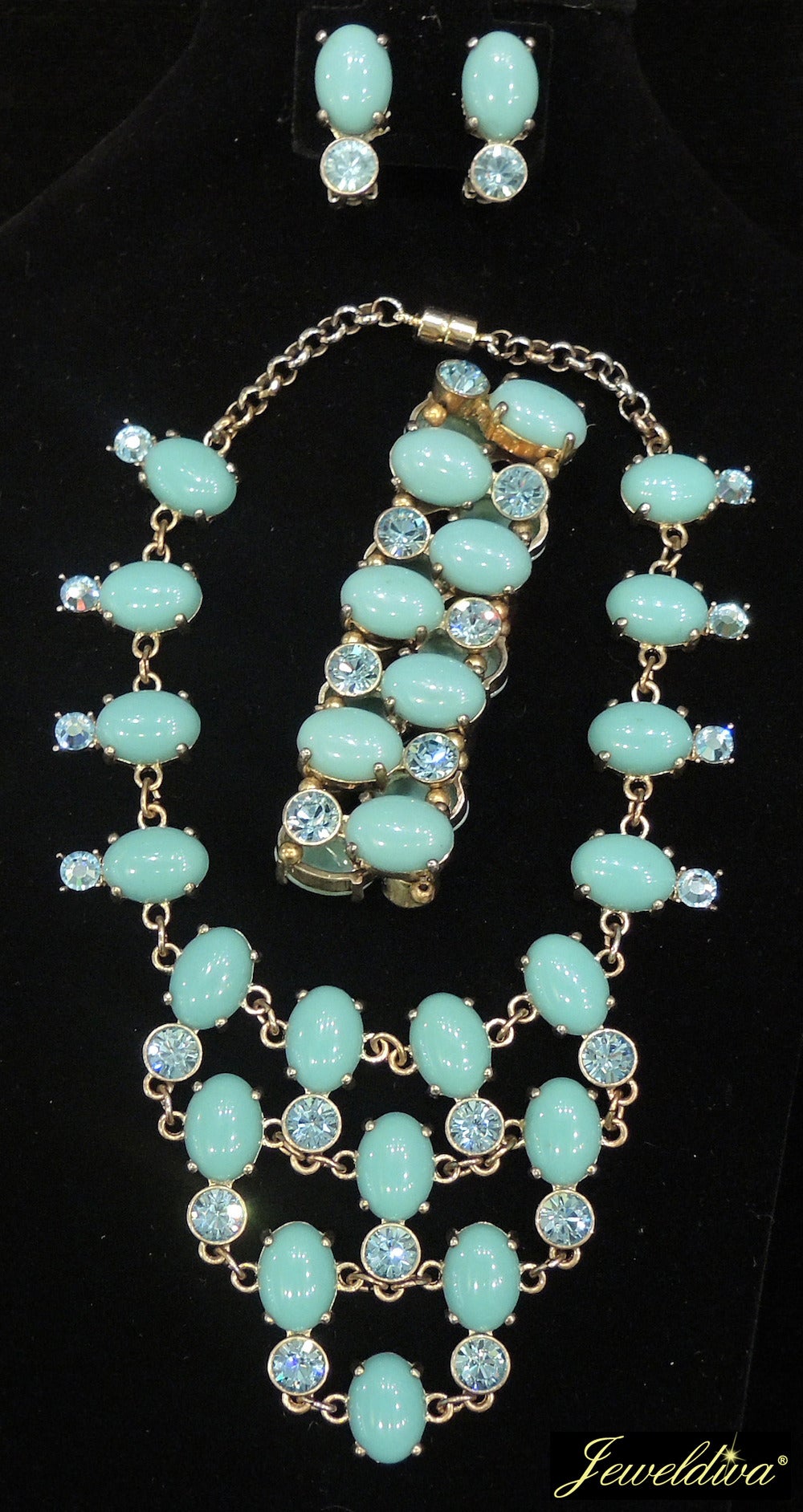 This French vintage signed “CN” set features cabochon cut faux turquoise stones with aqua color rhinestone accents in a gold-tone setting.  I was very happy to see the whole parure and I can’t figure out what year it was created.  It is very well