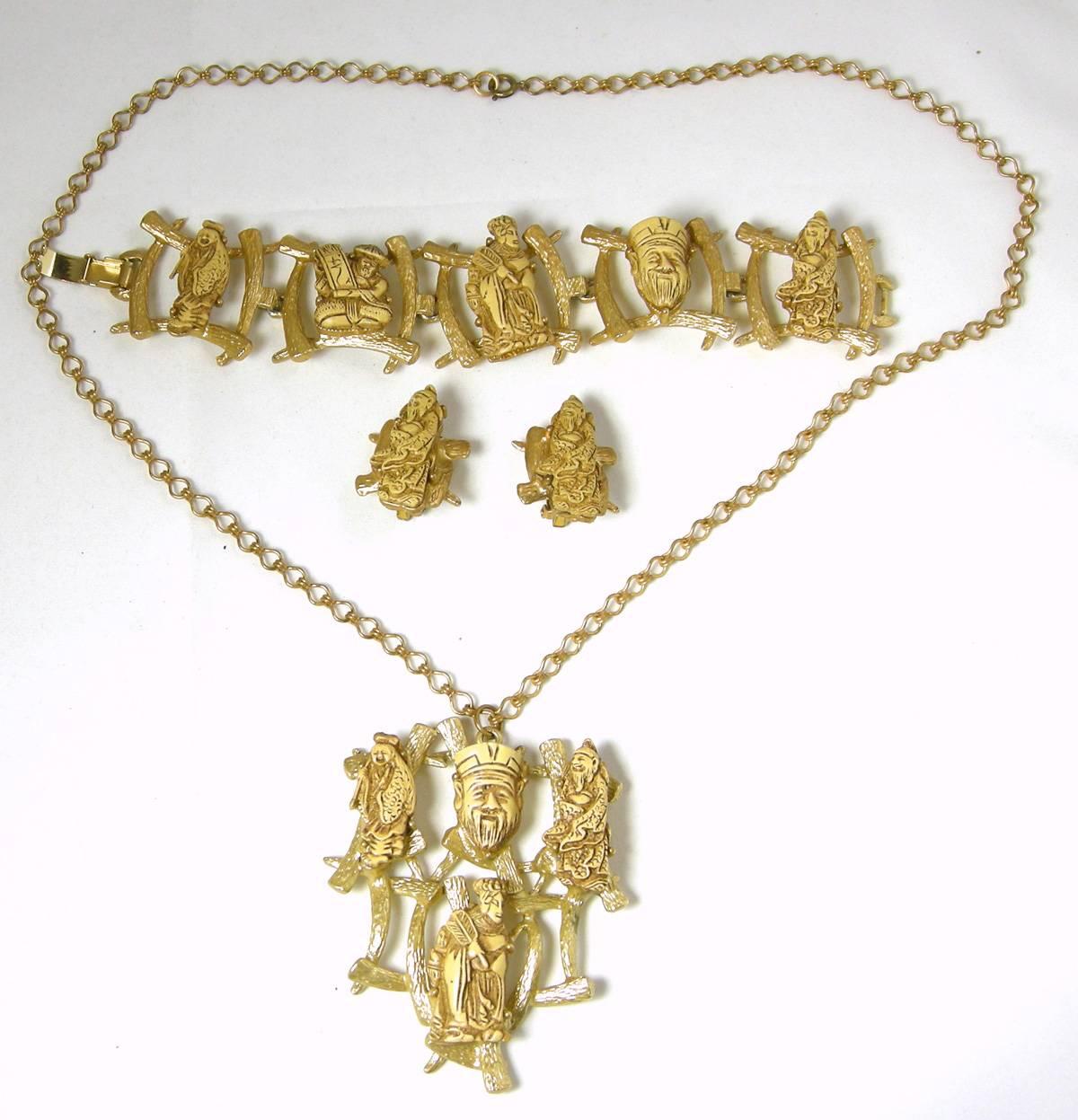 This is a fantastic 3 piece set consists of the necklace, bracelet and earrings.  Each piece is intricately carved and represents Buddha’s God of Fortune and Good Luck.  The necklace is 23” with a spring back clasp.  The pendant is 3” long x 2-1/4”