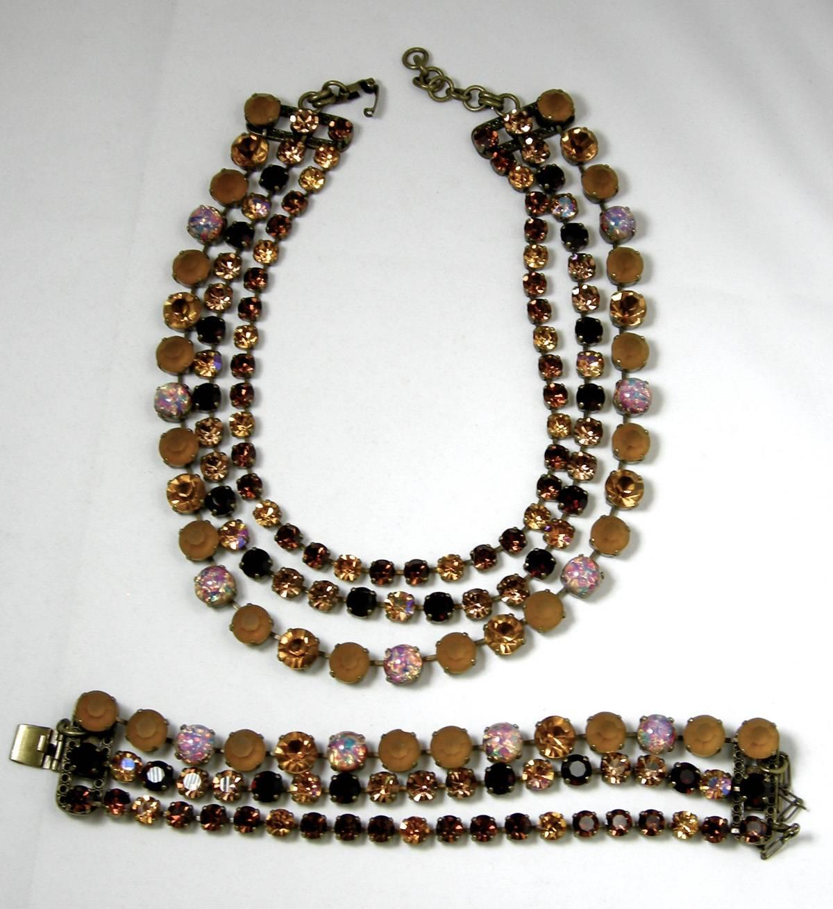This hard-to-find JL Blin set, here we have a stunning necklace and bracelet, each with 3 strands of dark & light topaz crystals with confetti stone accents in a gold-tone setting.  The necklace measures 17” x 1/2” on the largest stone; the bracelet