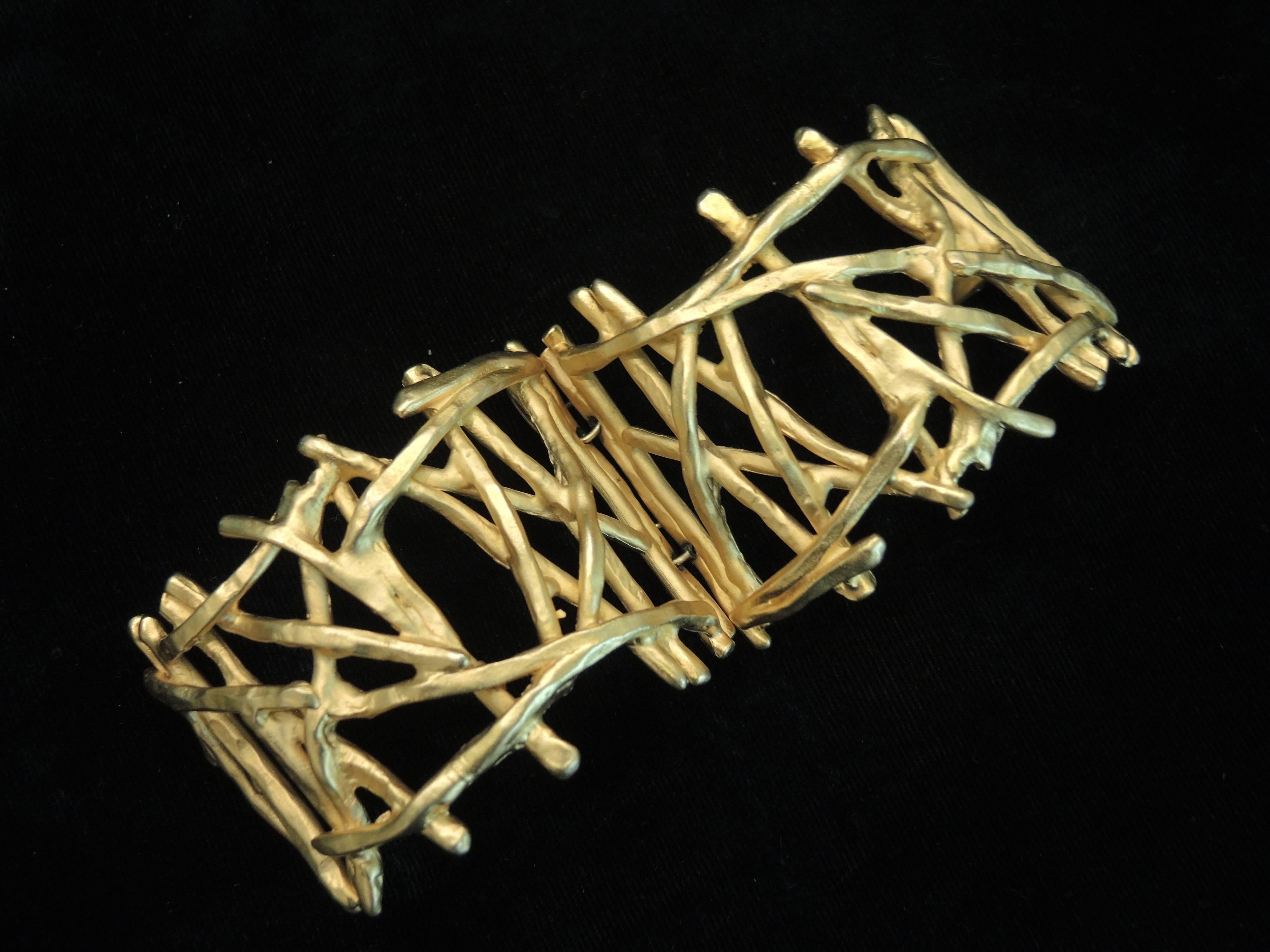 This vintage signed Christian LaCroix bracelet features the famous abstract ‘branches’ design in a gold-tone setting. In excellent condition, this bracelet measures 7” x 2 ¼” and is signed “Christian LaCroix Paris”.