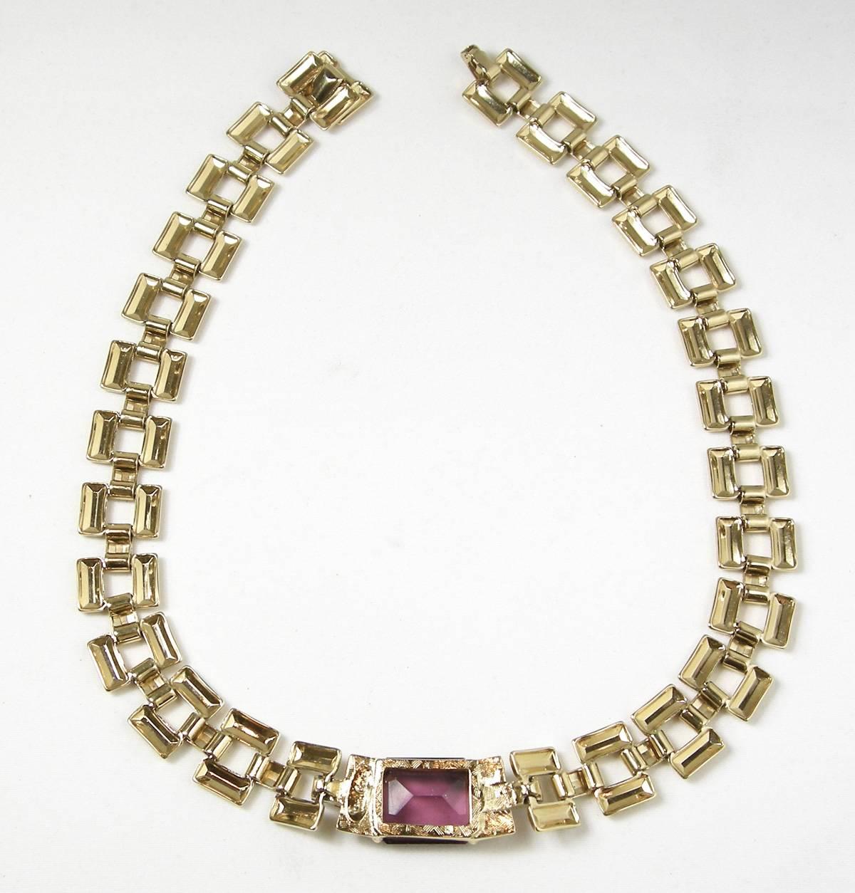 It is rare to find any Cardin jewelry and we were lucky to find this special necklace.  This is a beautiful vintage Pierre Cardin box chain necklace that features a large sized faux amethyst with crystals. It measures 16” x 3/4”. The amethyst