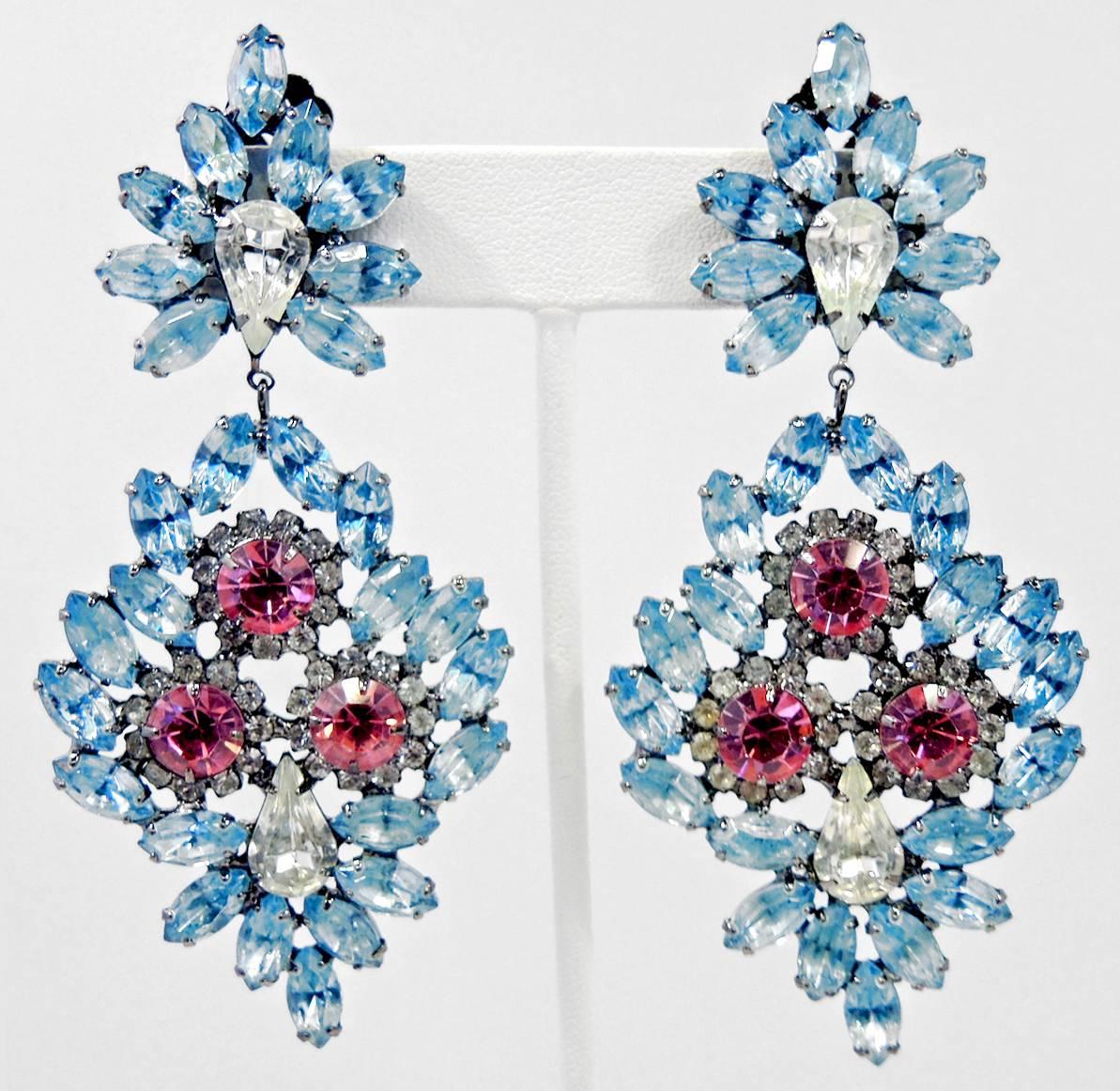 These Kenneth Jay Lane dangling earrings are absolutely stunning. The top has blue rhinestones encircling a brilliant clear teardrop clear center.  The bottom has a combination of blue and clear rhinestones with three large round pink rhinestones in
