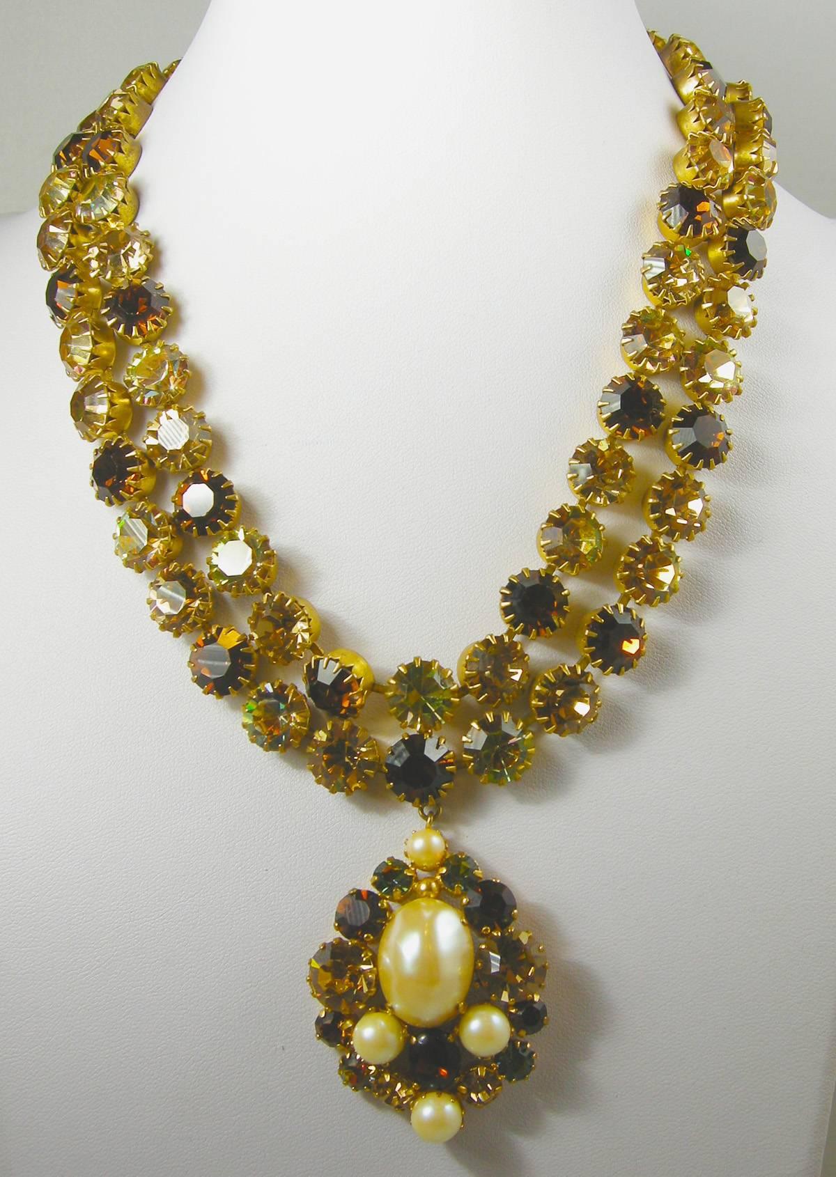 As a devoted fan of JL Blin of Paris … I know one when I see it.  Although this is not signed … I am absolutely sure it is JL Blin.  The structure and the design says it all. It has two rows of dark and light topaz sparkly crystals leading down to a