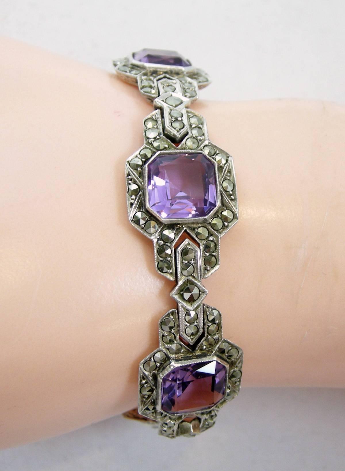 I love the early German bracelets.  It has six real stunning amethyst links surrounded with old marcasites.  It is signed “Germany” and “925”.  This bracelet has a slide-in clasp with a safety lock.  It measures 7” long x 5/8” wide.  This bracelet