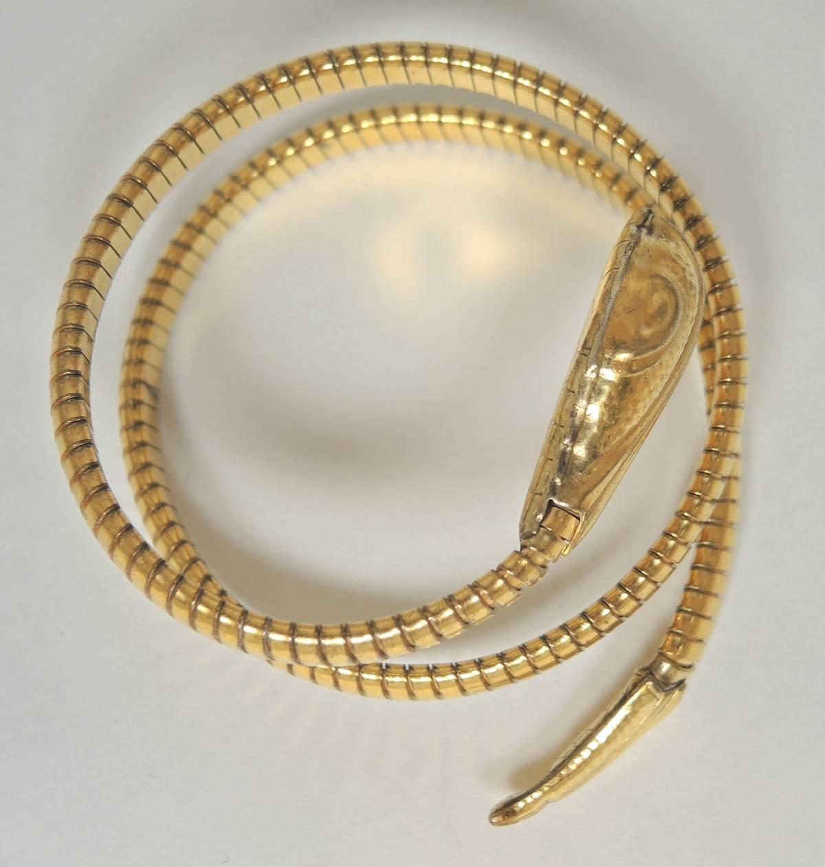 Everyone loves a serpent bracelet and I definitely love to collect them!  This vintage bracelet is very flexible and can be worn on the wrist or wrapped around the upper arm.  It is in a gold tone setting and has a ribbed design. This bracelet