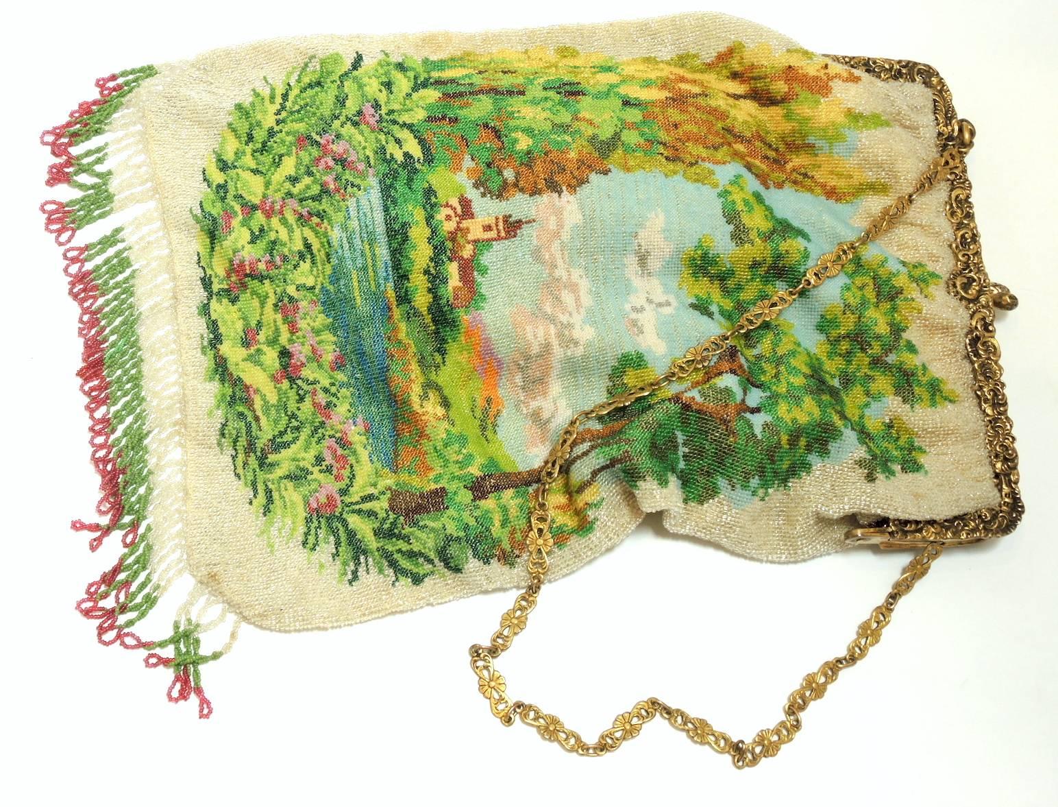 The scene of the dreamy castle nestled next to a lake with surrounding trees is beautifully designed.  This bag is in mint condition and is rather large compared to the standard pieces we seen in the past. It measures 11” x “7 wide and all the beads