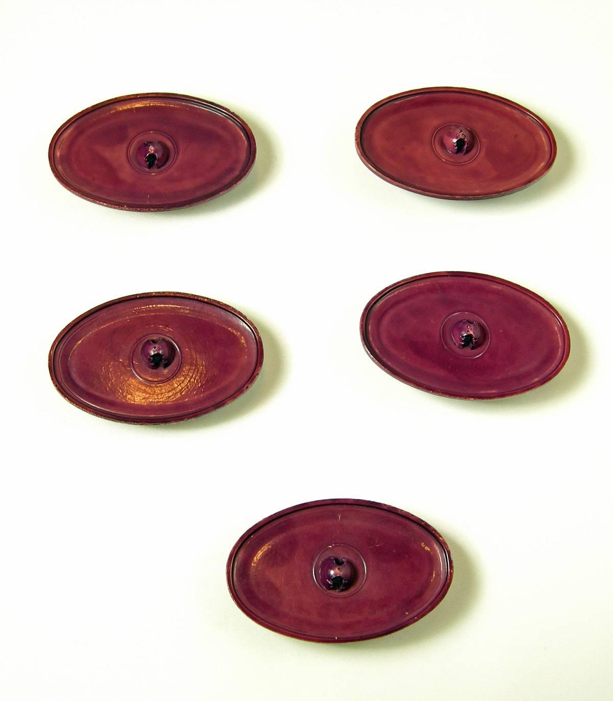 Anyone who knits for a football fan … this is an absolute must!  It would be fantastic on a heavy cardigan sweater. There are five oval shaped football celluloid buttons with detailing that’s amazing.  Each button is 2-1/4” long x 1-1/2” wide. 