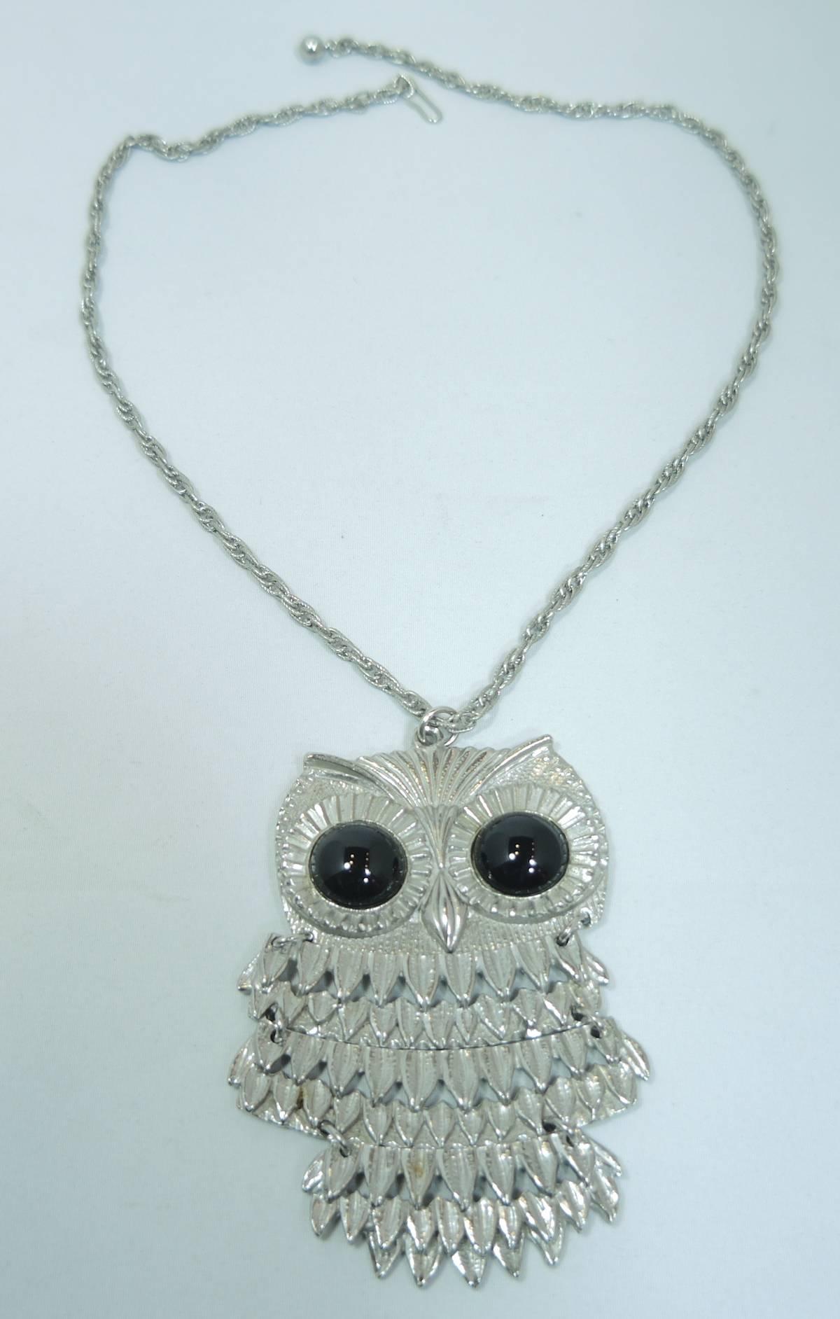 This is a sweet articulated owl pendant necklace that has black glass stones for eyes. This necklace measures 21” and the pendant measures 3-3/4” x 2-1/4”. It has a hook closure and is signed “Goldette” and is in excellent condition.