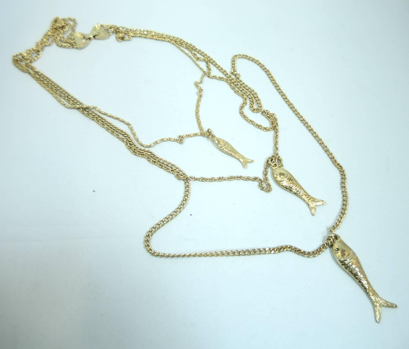 This is such an awesome necklace. Every chain has a fish pendant. The longest chain measures 36” and the shortest chain measures 24”. The pendants measure from the smallest 1-1/4” x 1/2” to the largest 2-1/4”. It is in a gold tone setting and is
