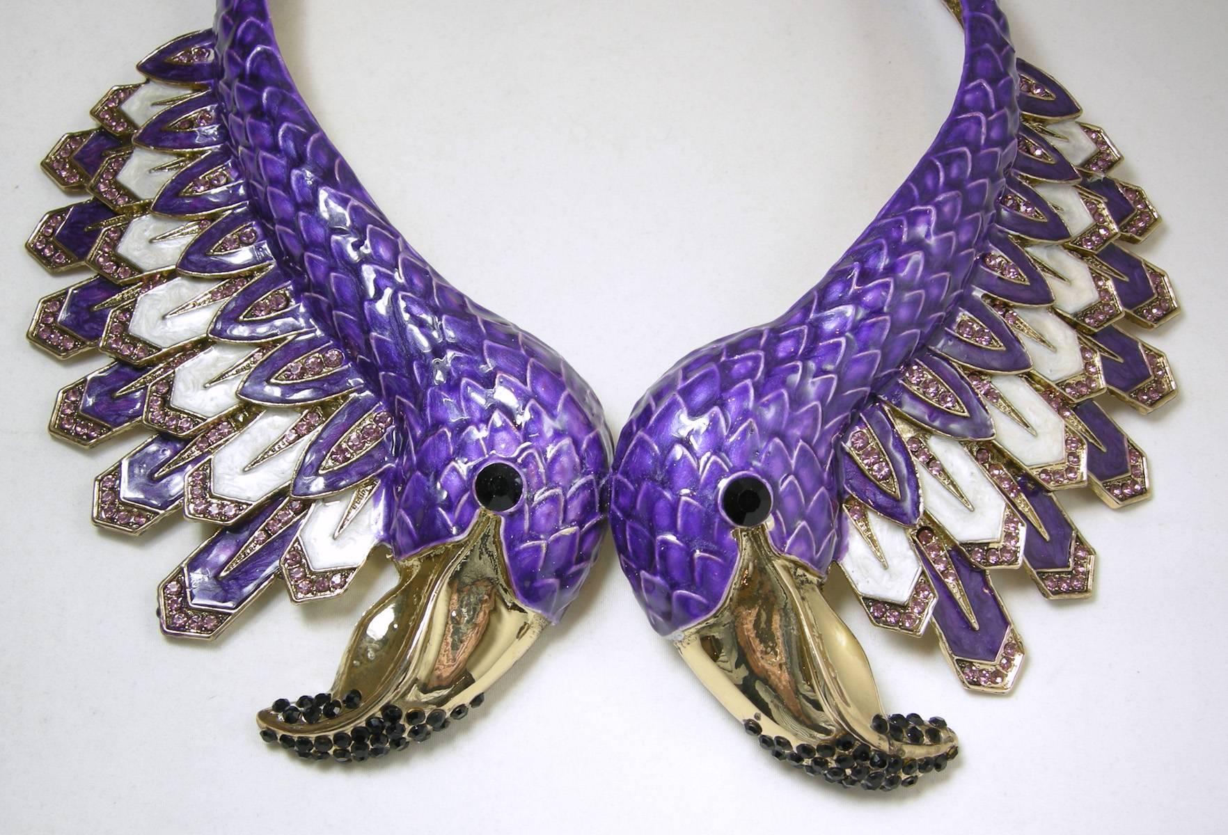 I saw  one of these necklaces and that one was signed  Roberto Cavalli. Although this necklace is not signed, it still will make heads turn. It opens in the front with two enameled flamingo heads with black stone eyes and a beak with black