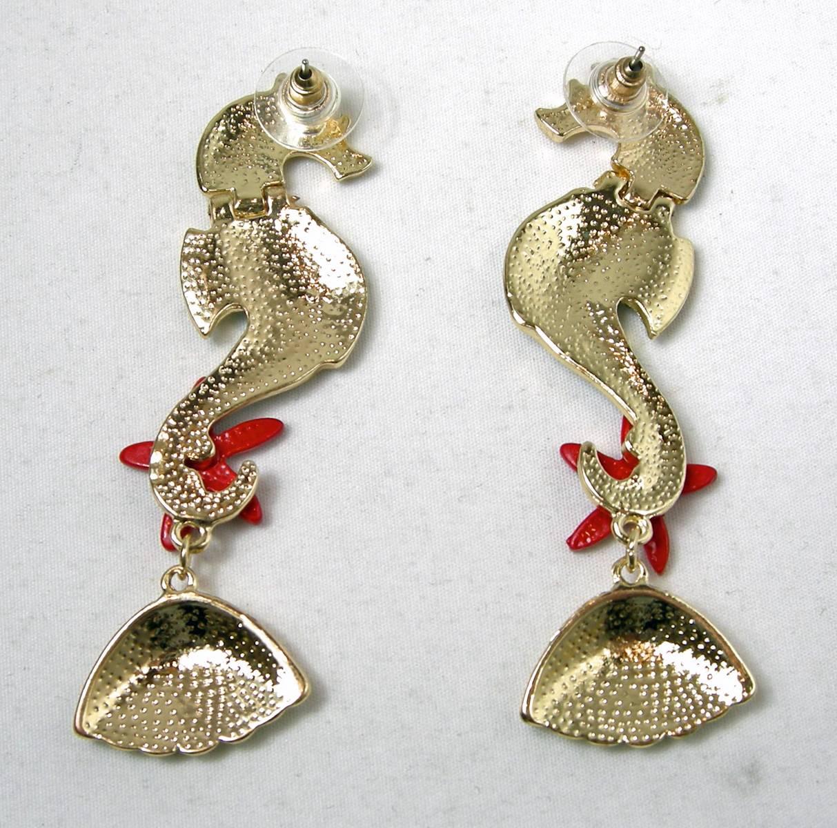 Although not signed, I was told these wonderful pierced earrings were designed by Butler & Wilson. They feature an adorable seahorse with clear rhinestones and blue enamel on its body. There is a red rhinestone studded starfish at the bottom of