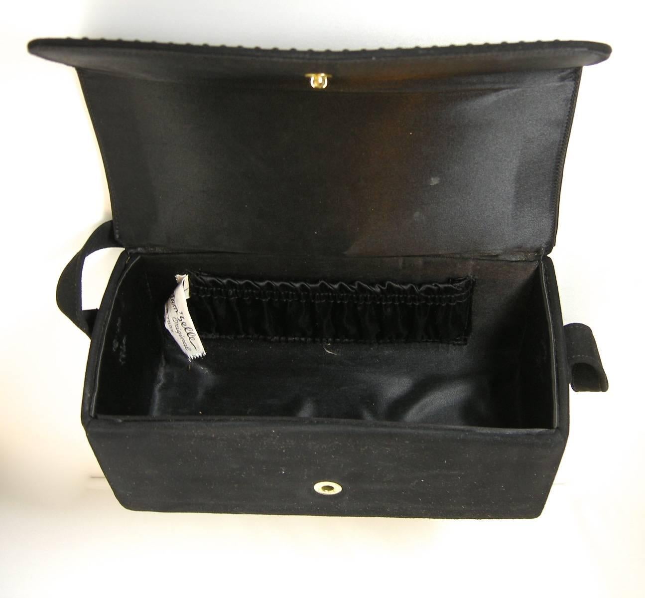 This vintage Mam’selle original handbag in black suede is gorgeous. The outside has black beads along the flap. It has a snap in closure. It has a rectangular shape and the inside is made with black satin and has a pocket in the inside. It measures